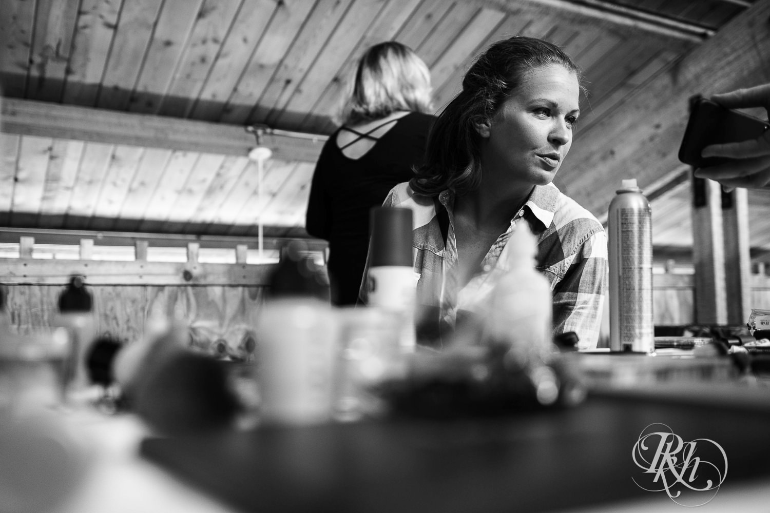 Brides get hair and makeup done before wedding at Spirit Mountain in Duluth, Minnesota.