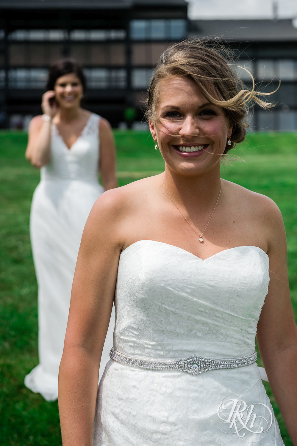 Lesbian brides do a first look outside at Spirit Mountain in Duluth, Minnesota.
