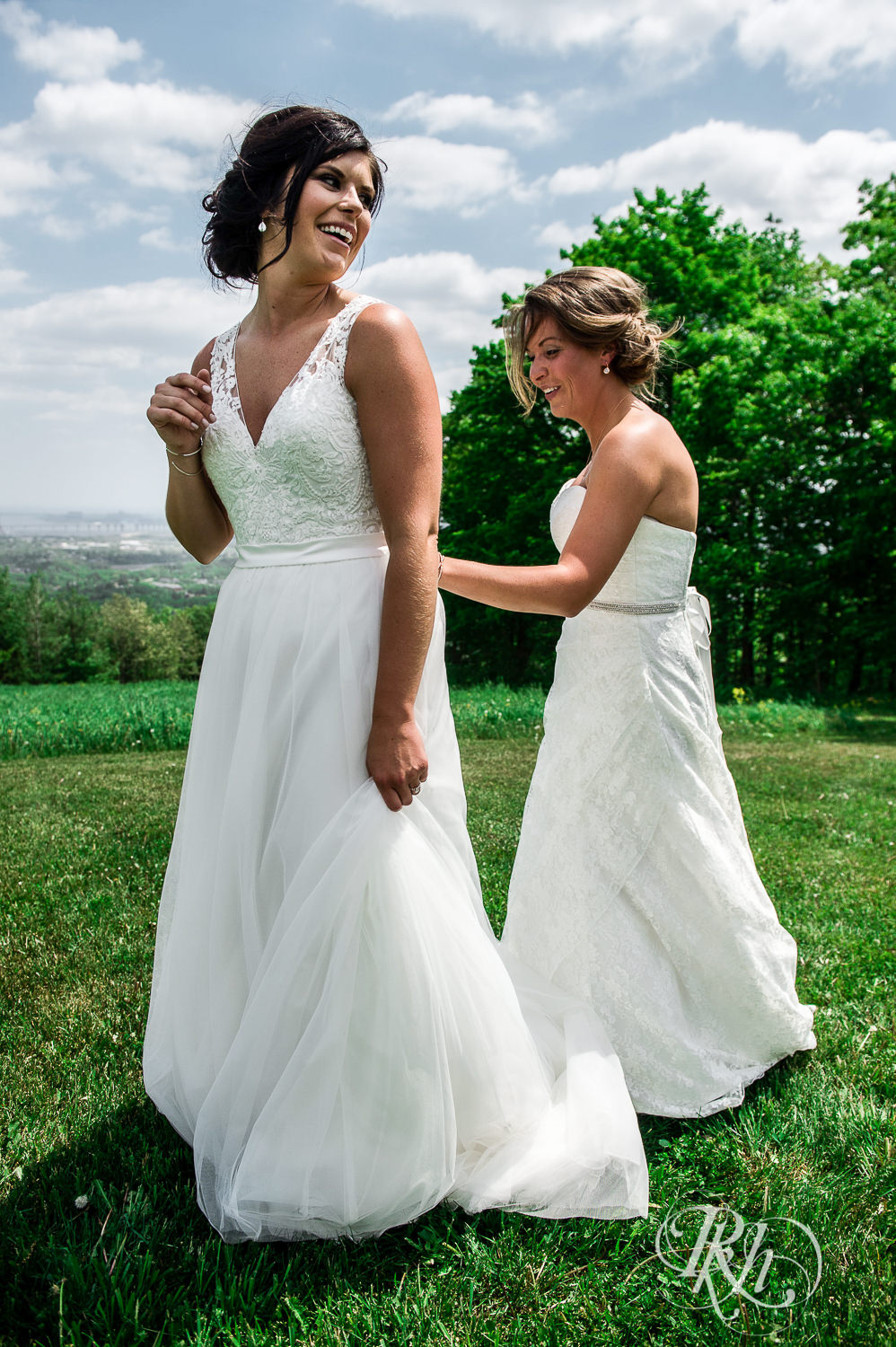 Lesbian brides do a first look outside at Spirit Mountain in Duluth, Minnesota.