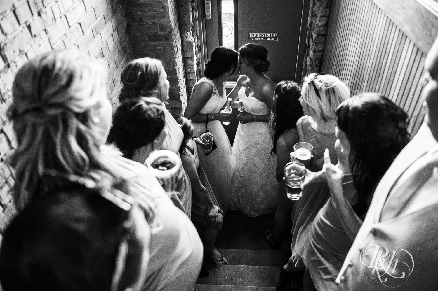 Lesbian brides kiss in a bar in Duluth, Minnesota.