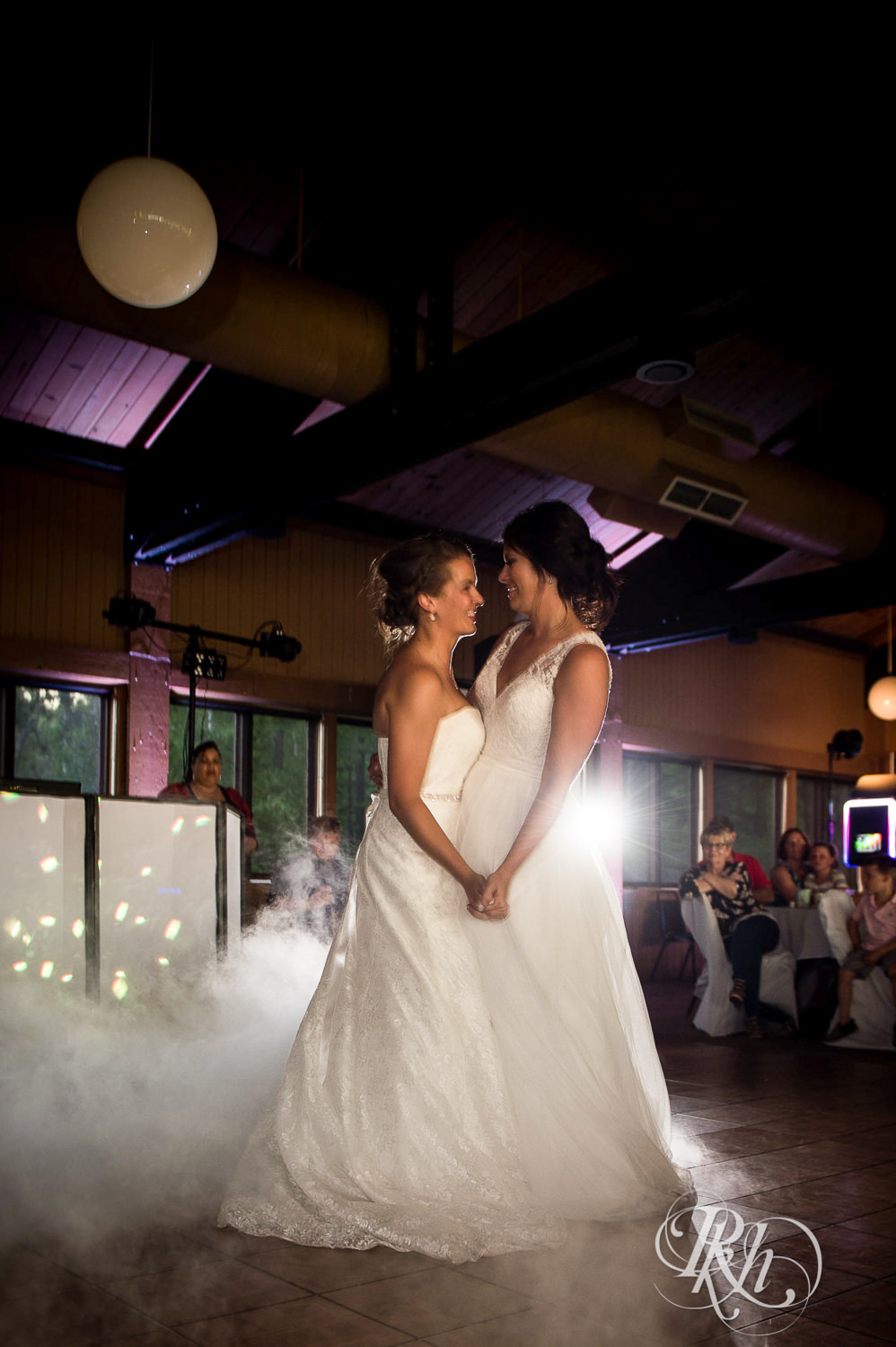 Lesbian brides dance during their wedding reception at Spirit Mountain in Duluth, Minnesota.