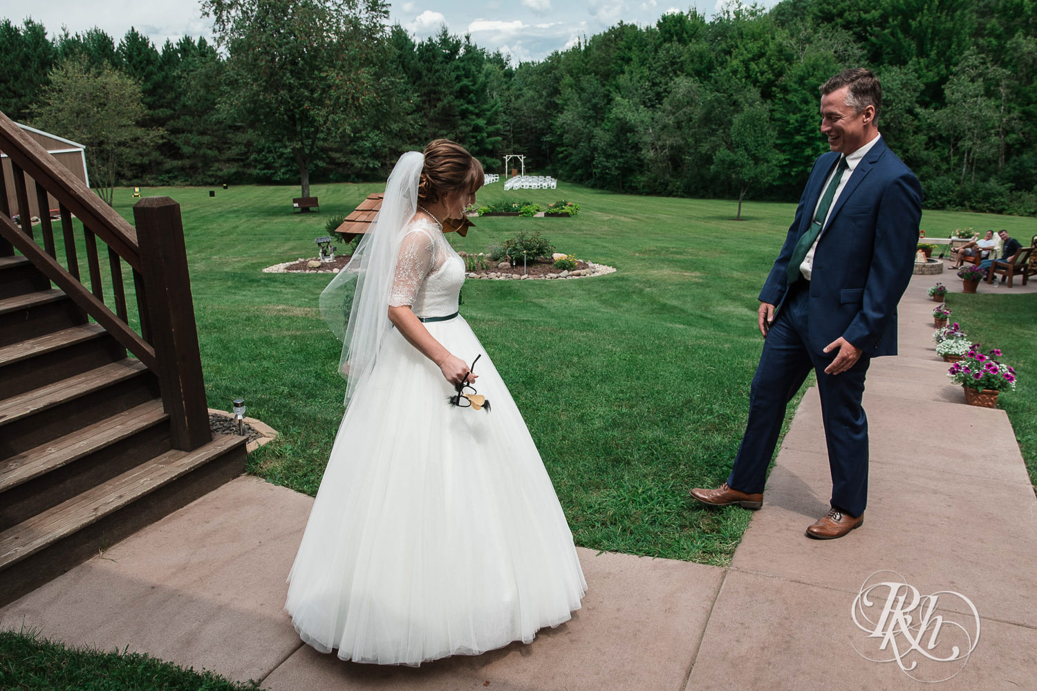 Bride and groom laugh during first look on wedding day in Elk Mound, Wisconsin.