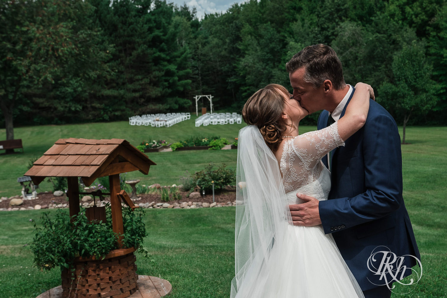 Bride and groom kiss during first look on wedding day in Elk Mound, Wisconsin.