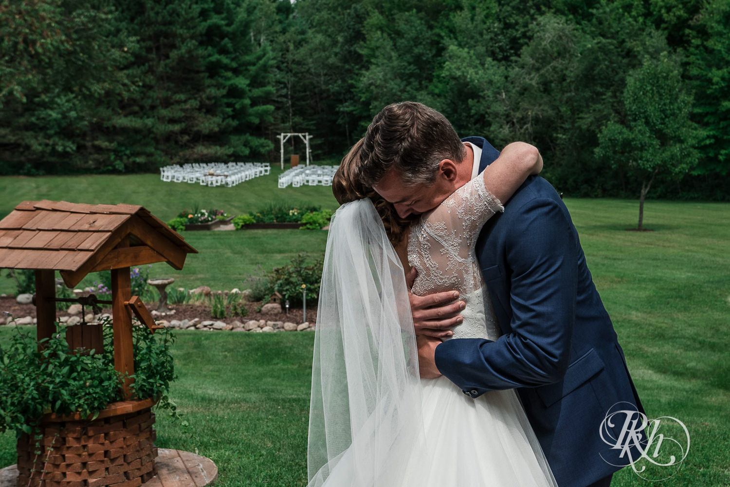 Bride and groom hug during first look on wedding day in Elk Mound, Wisconsin.