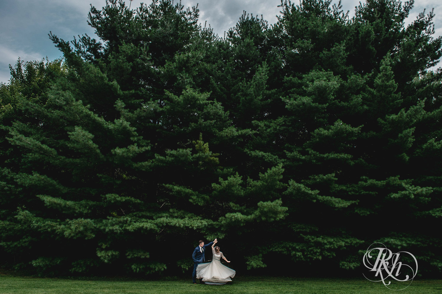 Bride and groom dance in the woods on wedding day in Elk Mound, Wisconsin.