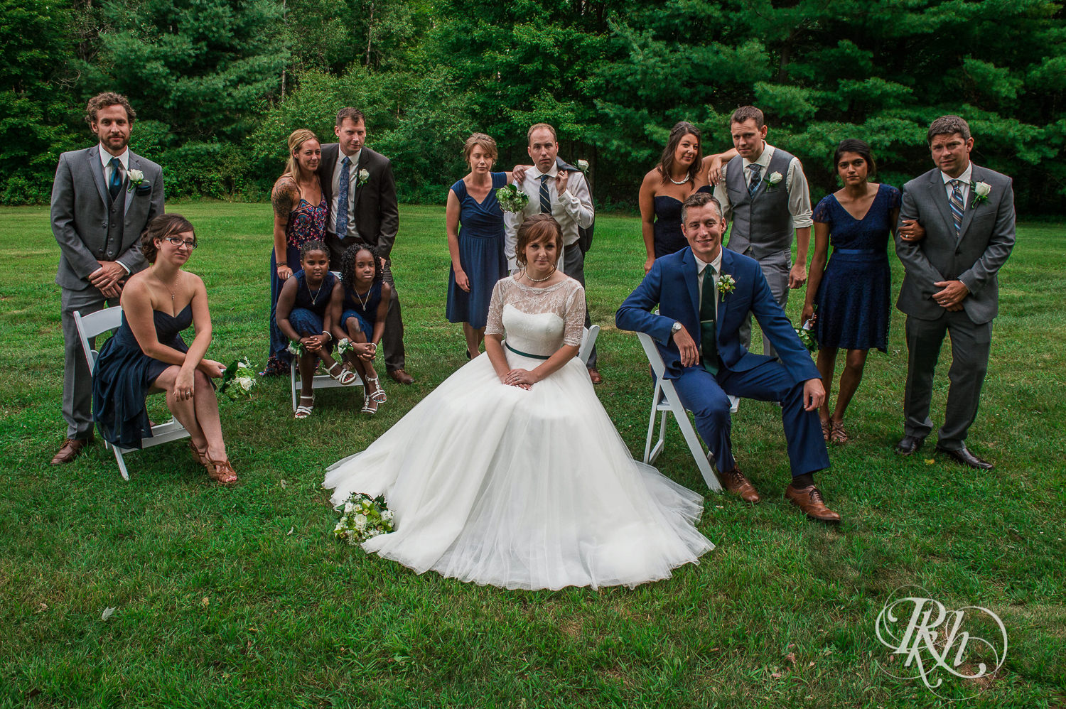 Wedding party and bride and groom smile in Elk Mound, Wisconsin.
