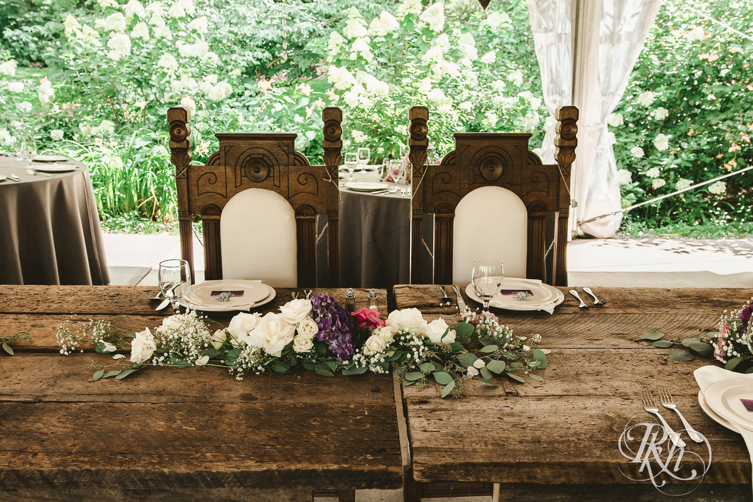 Outdoor summer wedding reception setup at Camrose Hill Flower Farm in Stillwater, Minnesota.