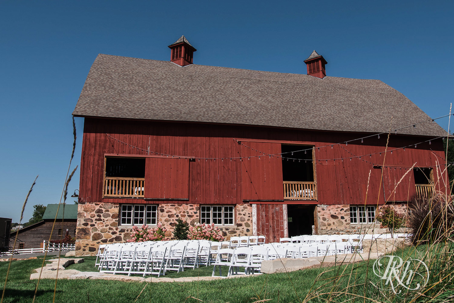 Outdoor barn wedding ceremony setup at Birch Hill Barn in Glenwood City, Wisconsin.