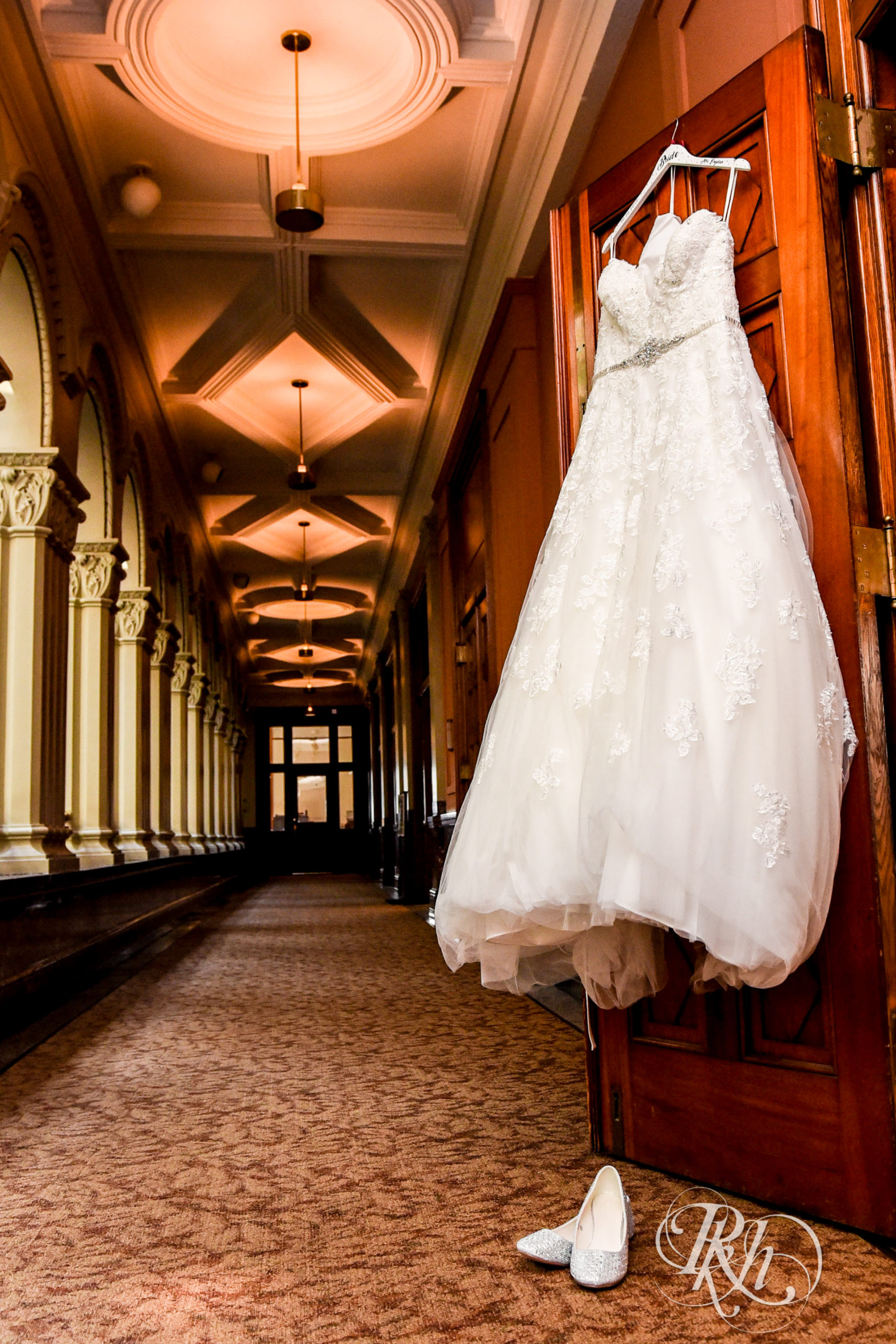 Wedding dress hanging on door at Landmark Center in Saint Paul, Minnesota.