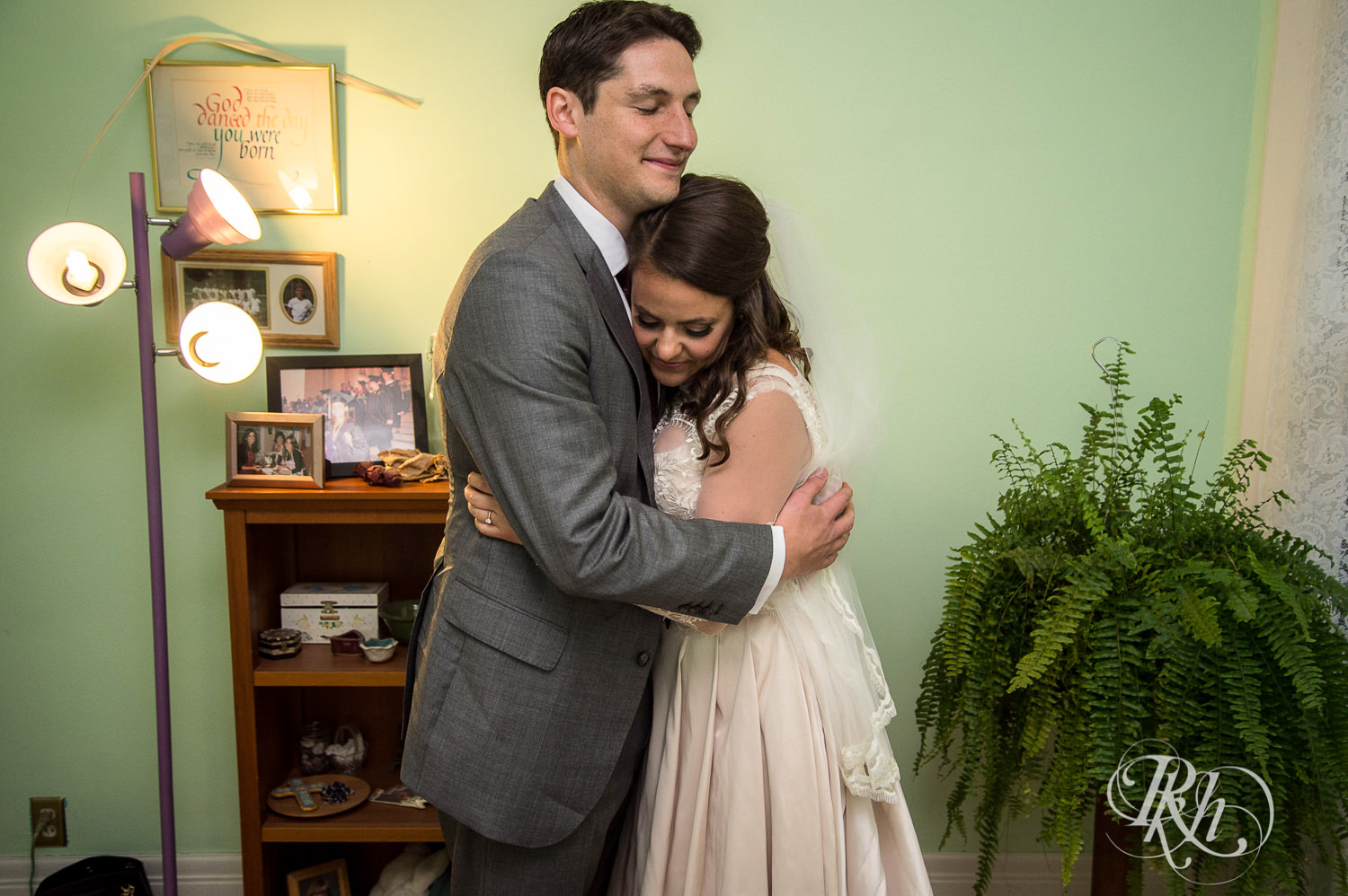 Groom and bride do first look on her wedding day in her childhood home in Saint Paul, Minnesota.