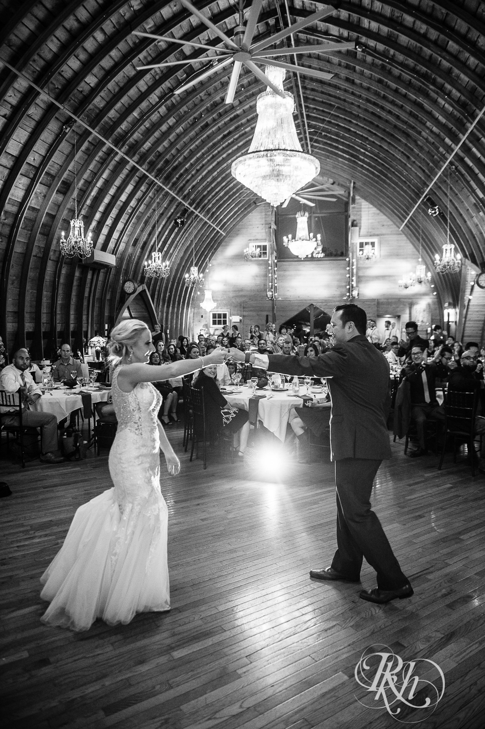 Bride and groom dance at Green Acres Event Center barn wedding in Eden Prairie, Minnesota.