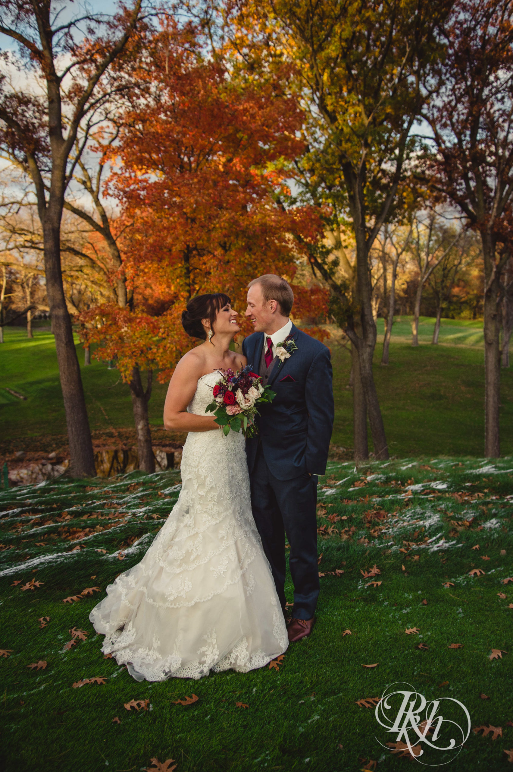 Bride and groom smile on fall wedding day at Minneapolis Golf Club in Minneapolis, Minnesota.