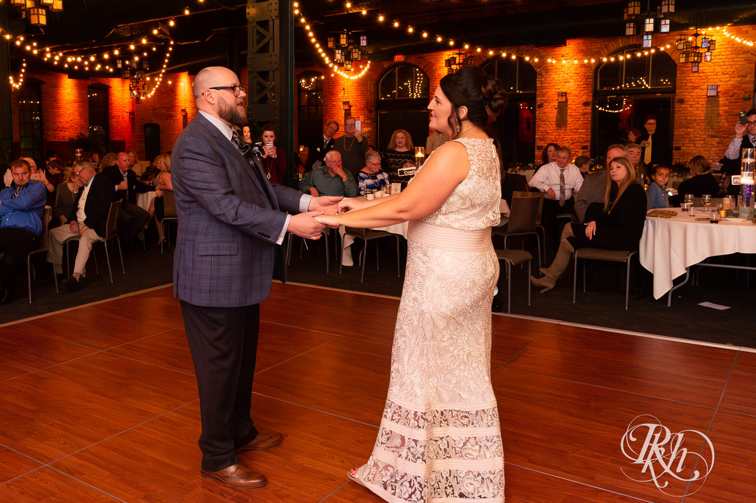 Bride and groom share first wedding dance at Nicollet Island Pavilion in Minneapolis, Minnesota.