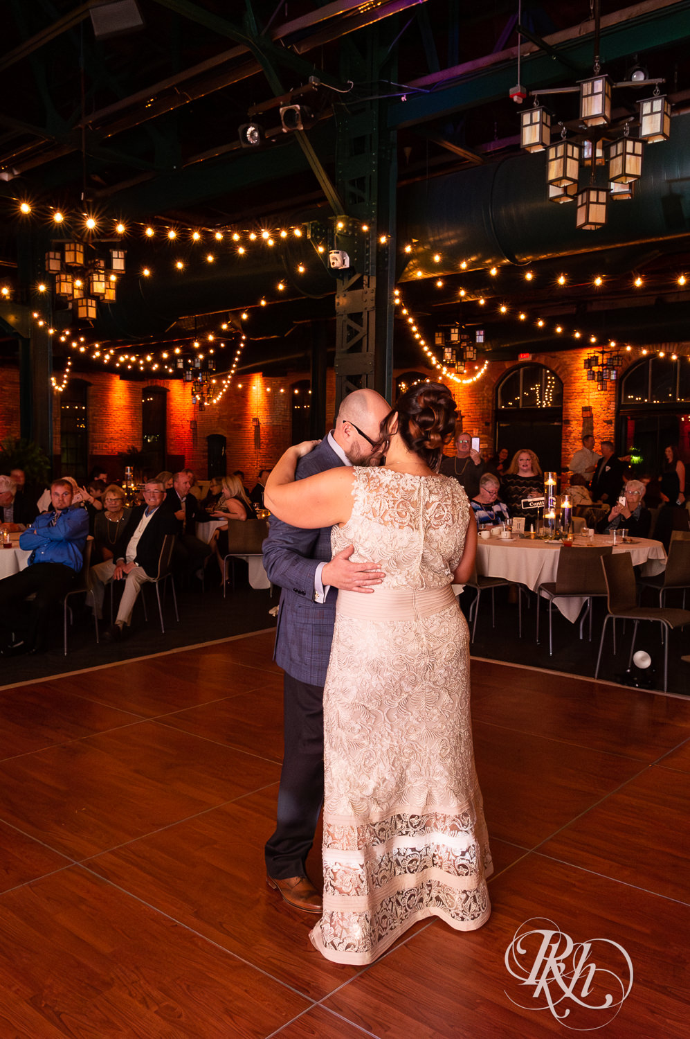 Bride and groom share first wedding dance at Nicollet Island Pavilion in Minneapolis, Minnesota.