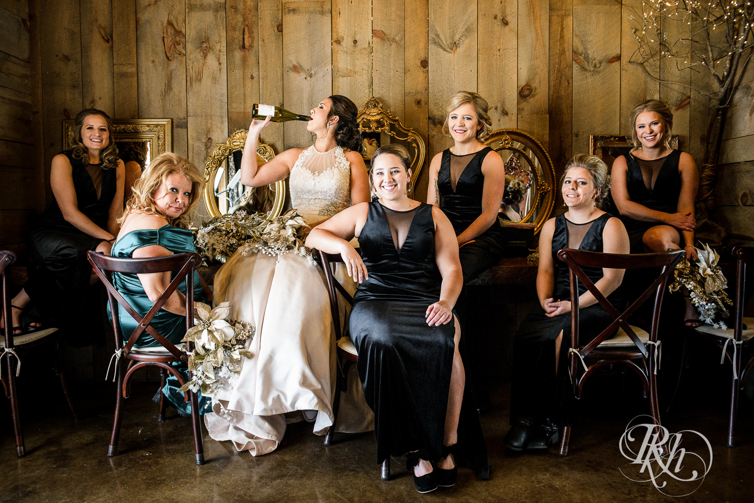 Wedding party smiles with the bride during winter wedding at Creekside Farm in Rush City, Minnesota.