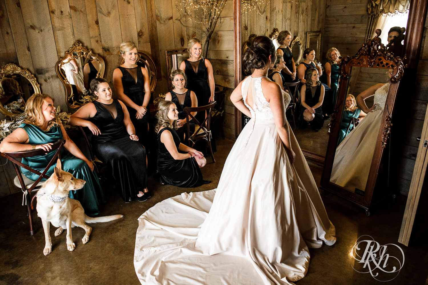 Wedding party smiles with the bride during winter wedding at Creekside Farm in Rush City, Minnesota.