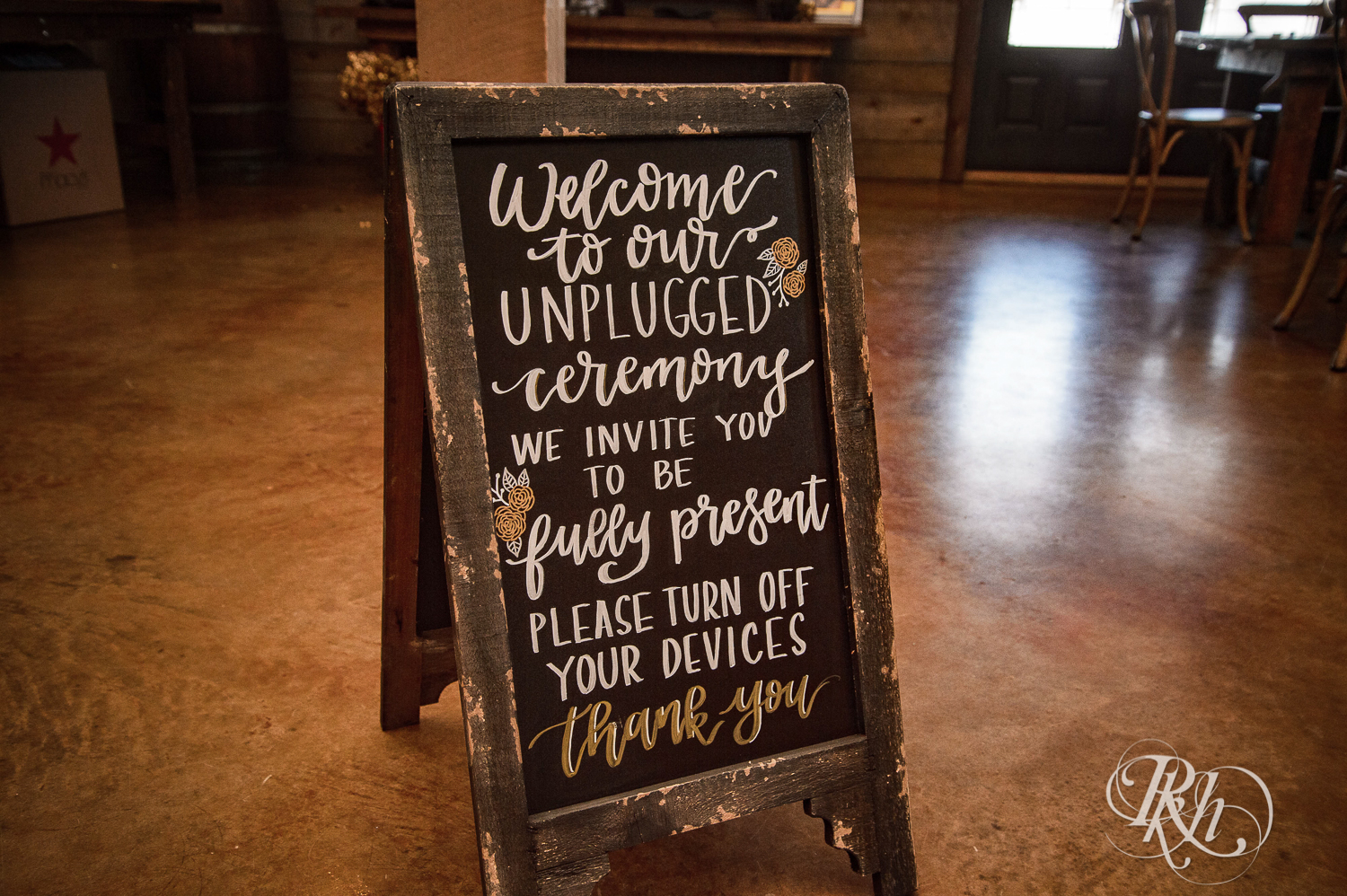 Unplugged ceremony sign at a wedding.