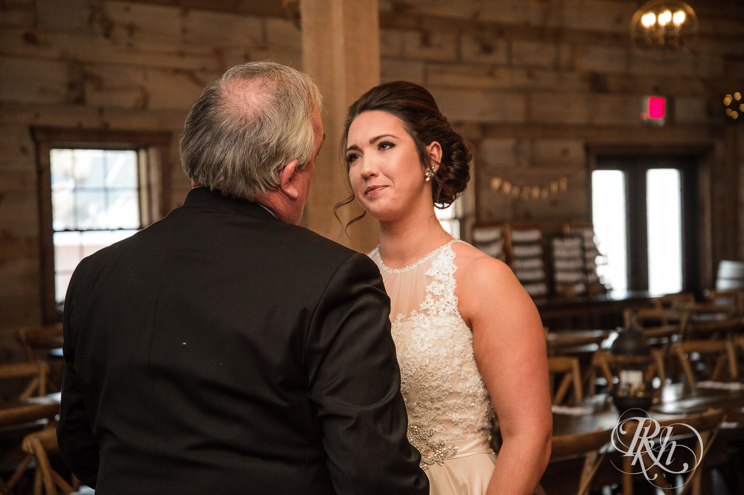 Bride does first look with her dad before wedding at Creekside Farm in Rush City, Minnesota.
