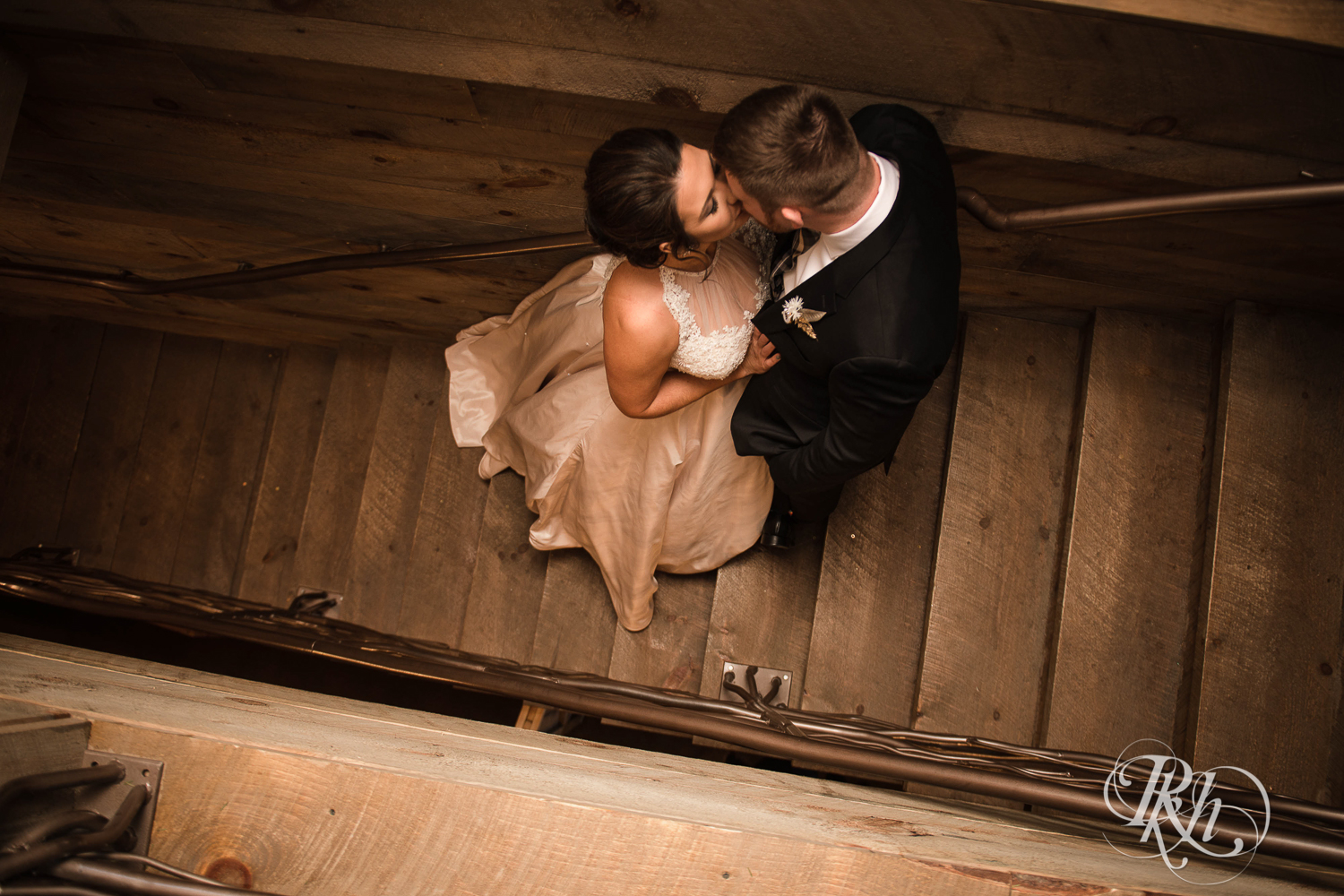 Bride and groom kiss during winter wedding at Creekside Farm in Rush City, Minnesota.