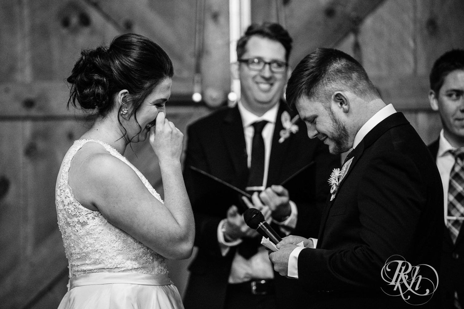 Bride and groom smile during new year's eve wedding ceremony at Creekside Farm in Rush City, Minnesota.