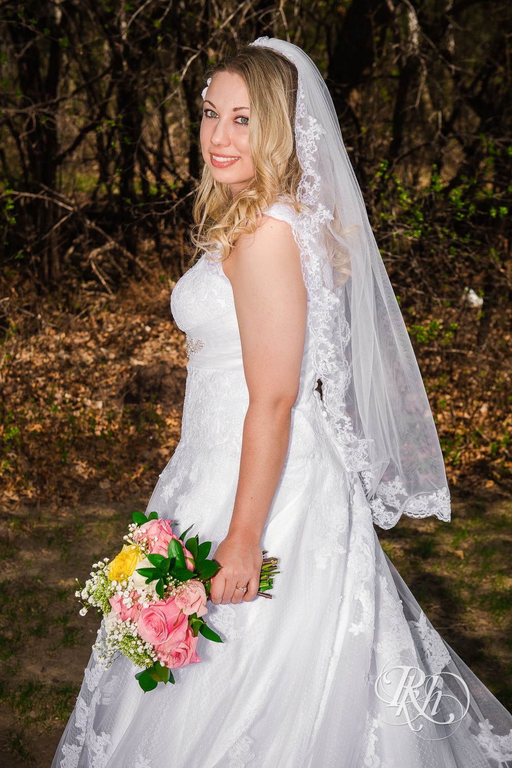 Bride smiles during at North Metro Event Center wedding in Shoreview, Minnesota.