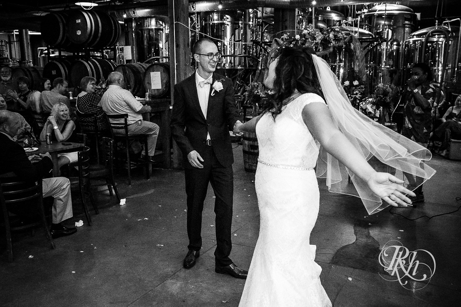 Bride and groom dance during brewery wedding reception at 612 Brew in Minneapolis, Minnesota.
