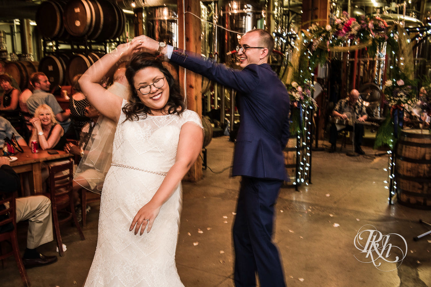 Bride and groom dance during brewery wedding reception at 612 Brew in Minneapolis, Minnesota.