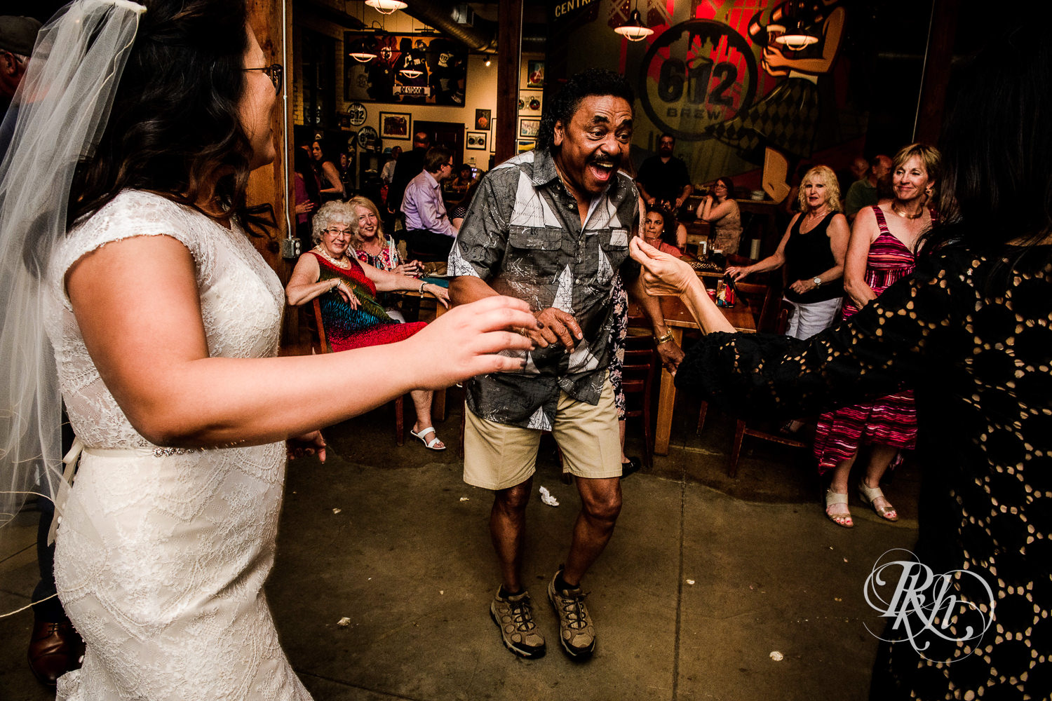 Guests dance during brewery wedding reception at 612 Brew in Minneapolis, Minnesota.