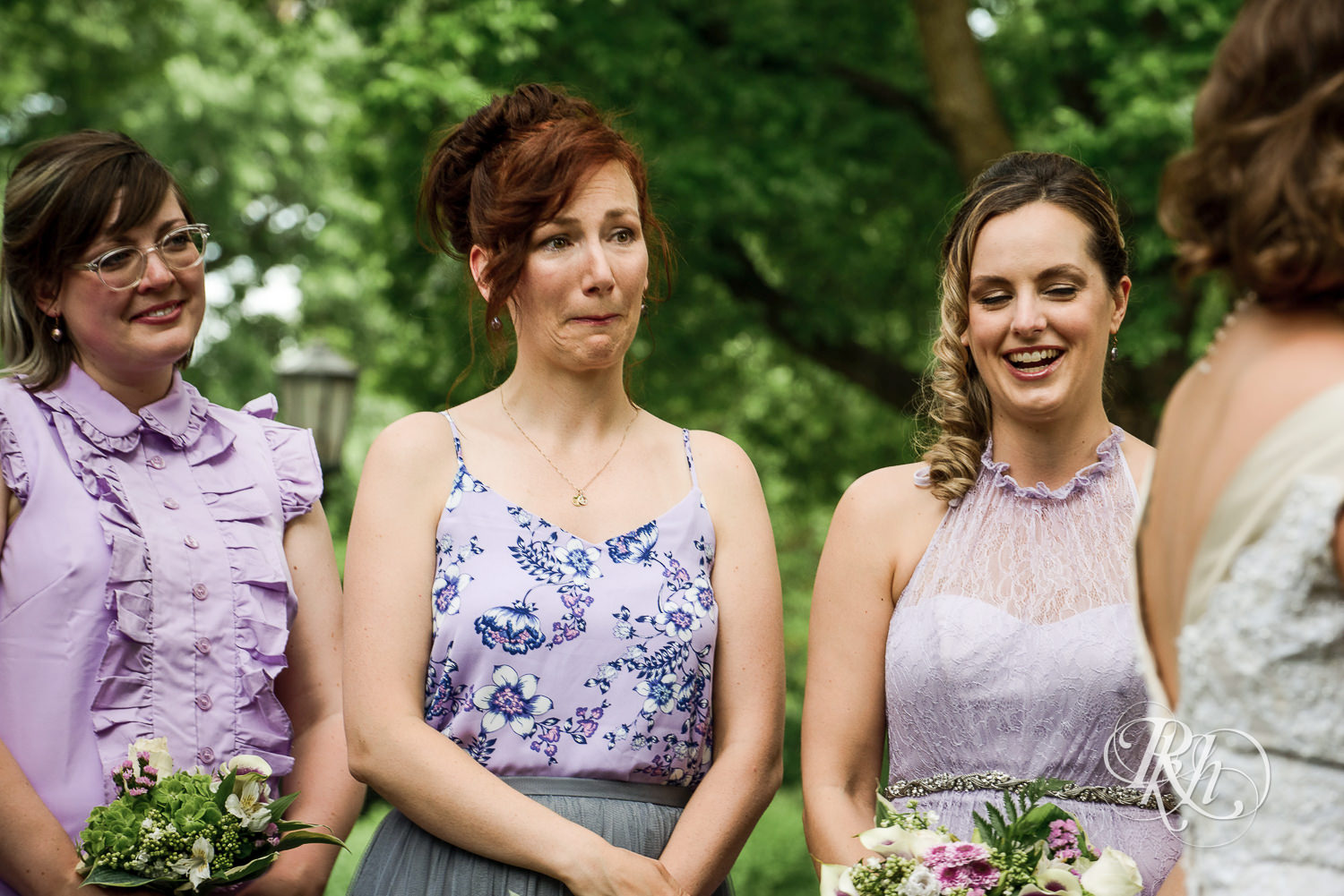 Bridesmaids cry during wedding ceremony at Summit Manor Reception House in Saint Paul, Minnesota.