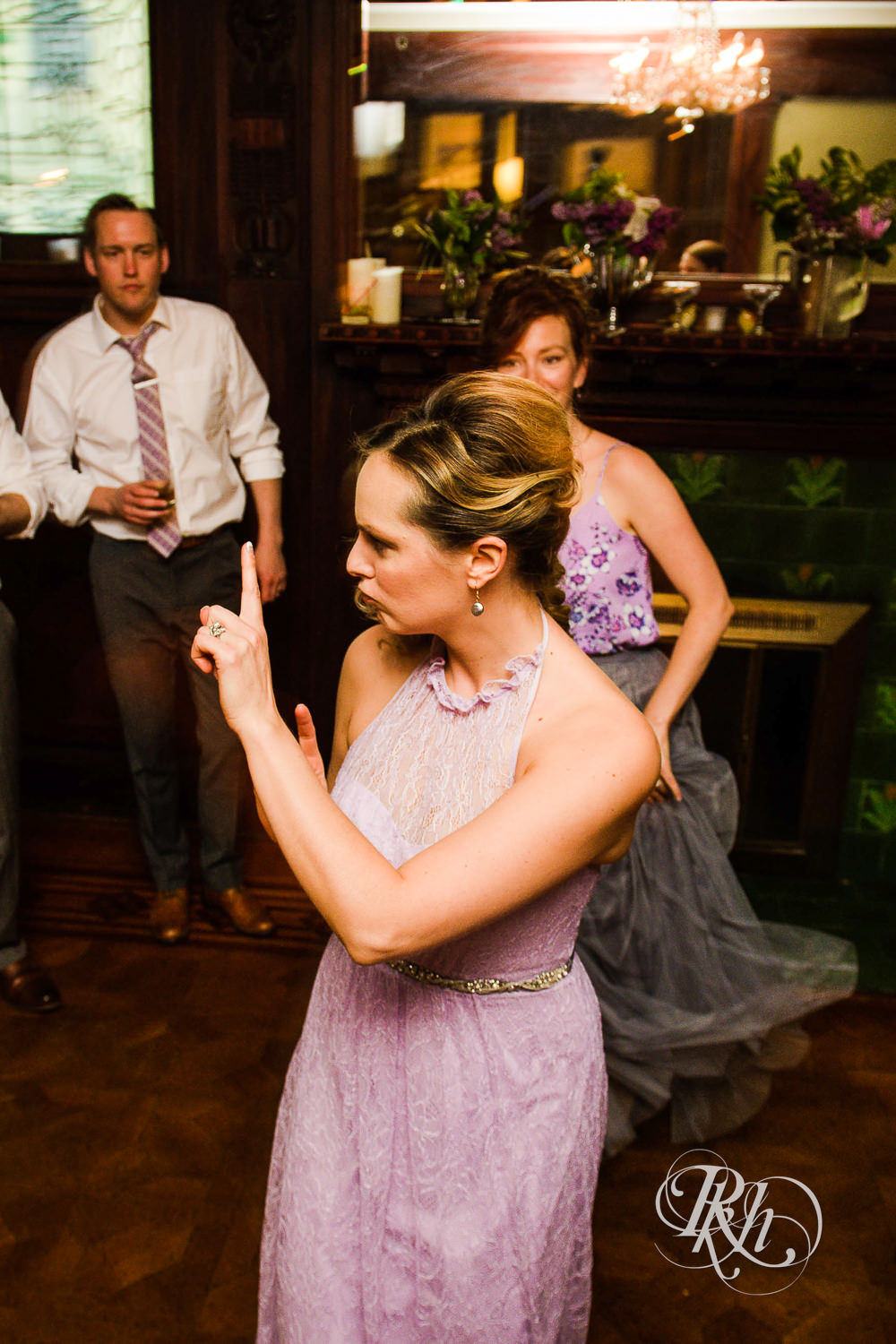Guests dance during wedding reception at Summit Manor wedding in Saint Paul, Minnesota.