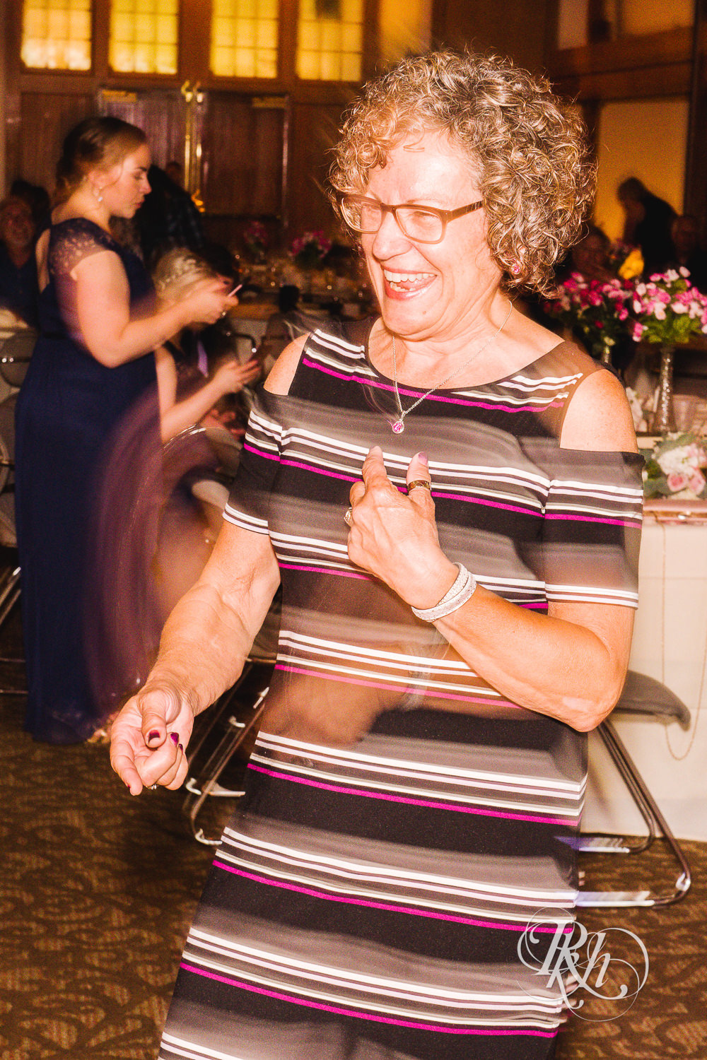 Long exposure photos of guests dancing at wedding reception at Earle Brown Heritage Center in Brooklyn Center, Minnesota.