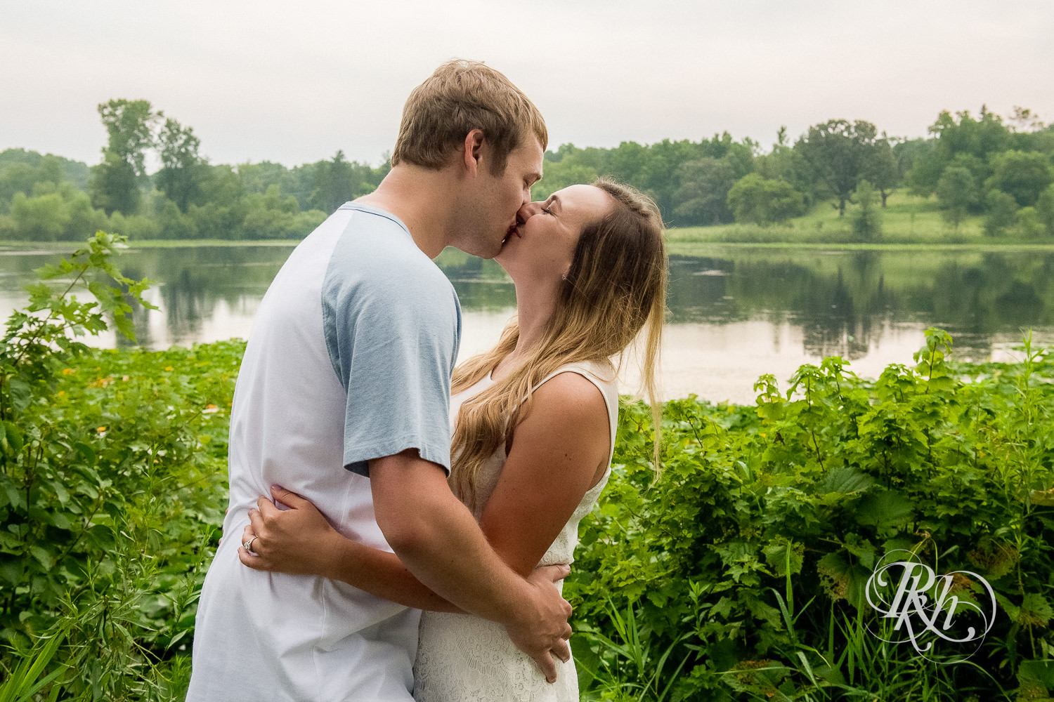Man and woman kiss each other in Lebanon Hills Regional Park in Eagan, Minnesota.