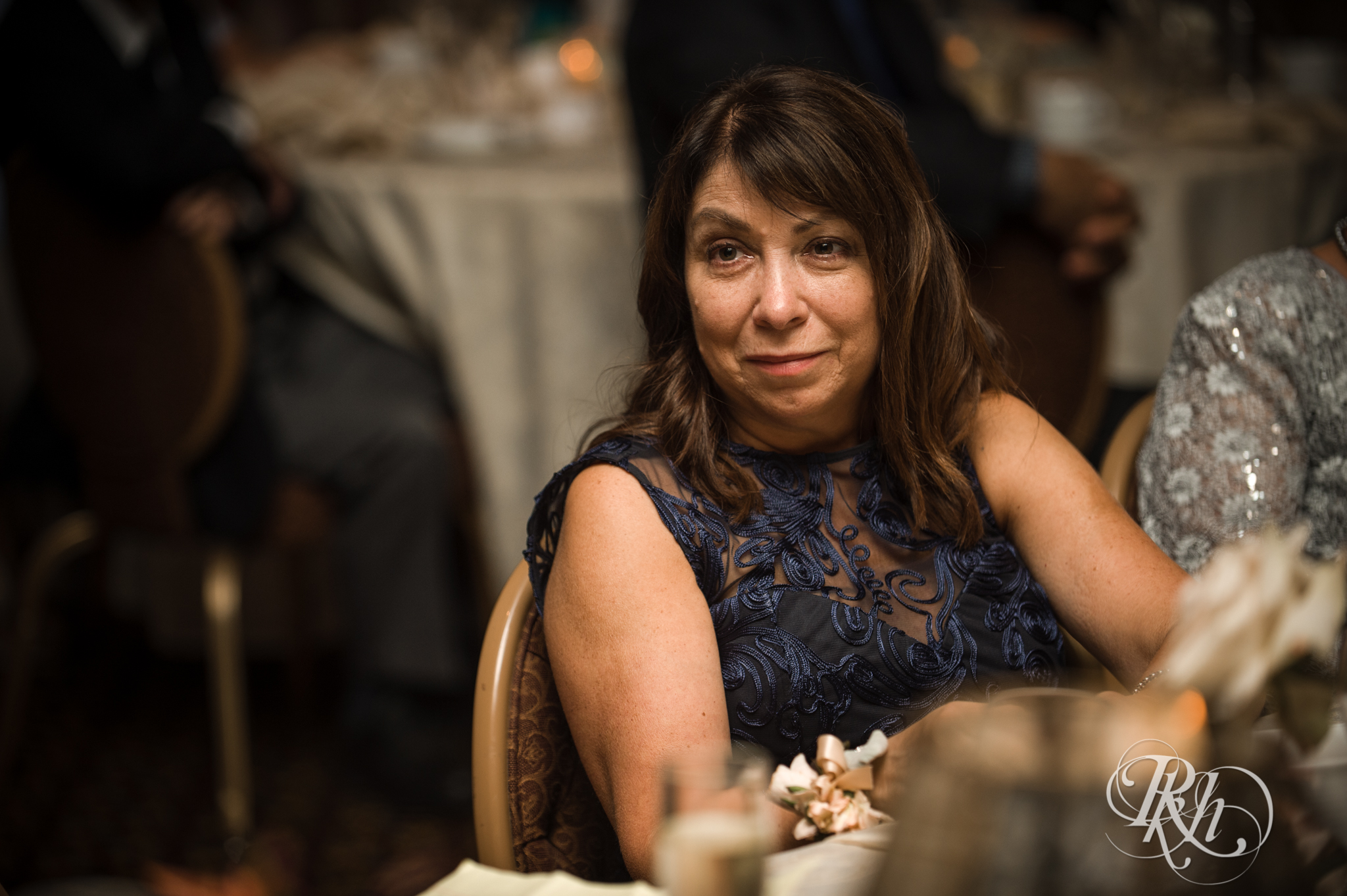 Mother of bride smiles during wedding reception at the Saint Paul Hotel in Saint Paul, Minnesota.