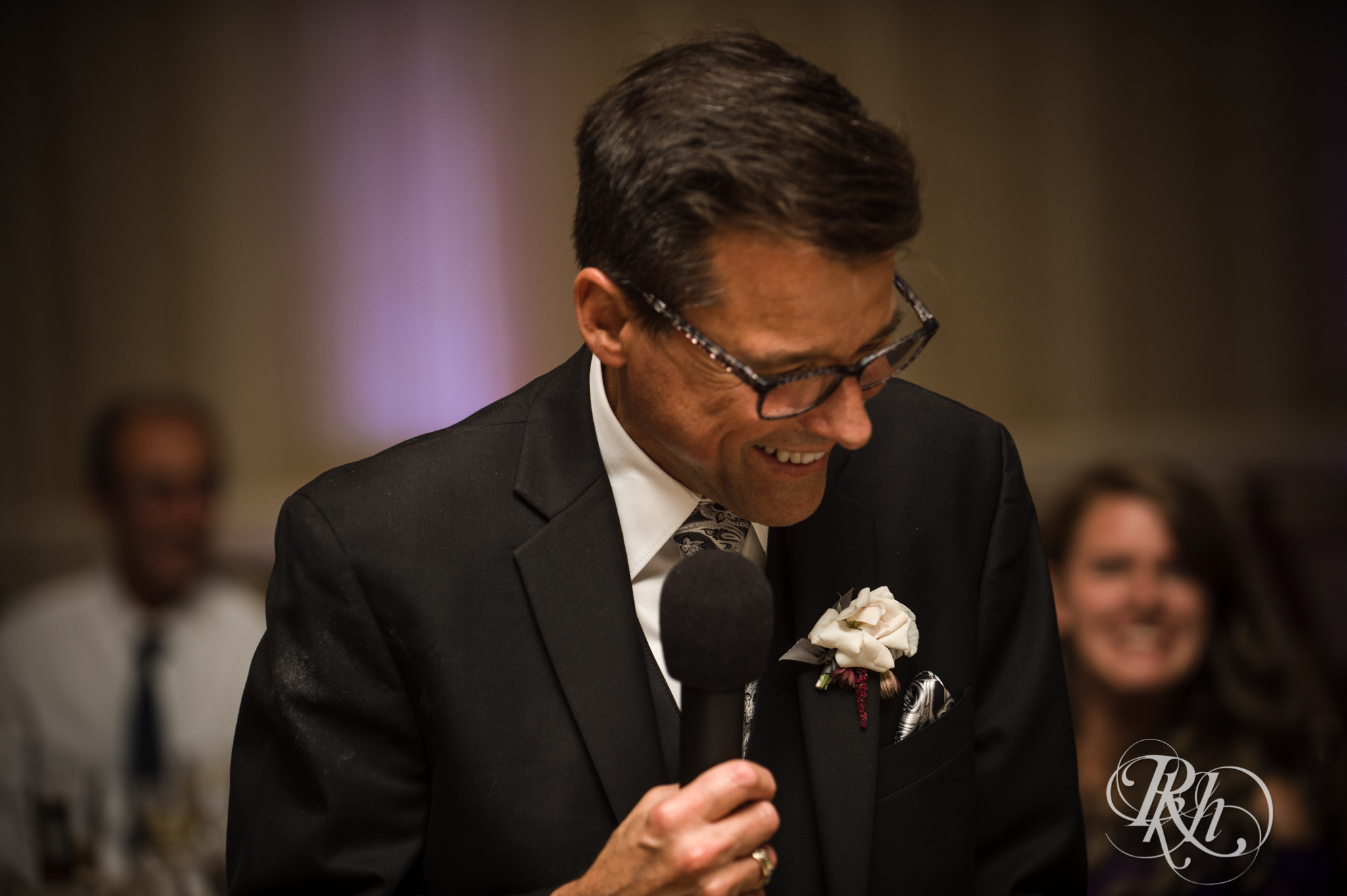 Father of bride smiles during wedding reception at the Saint Paul Hotel in Saint Paul, Minnesota.
