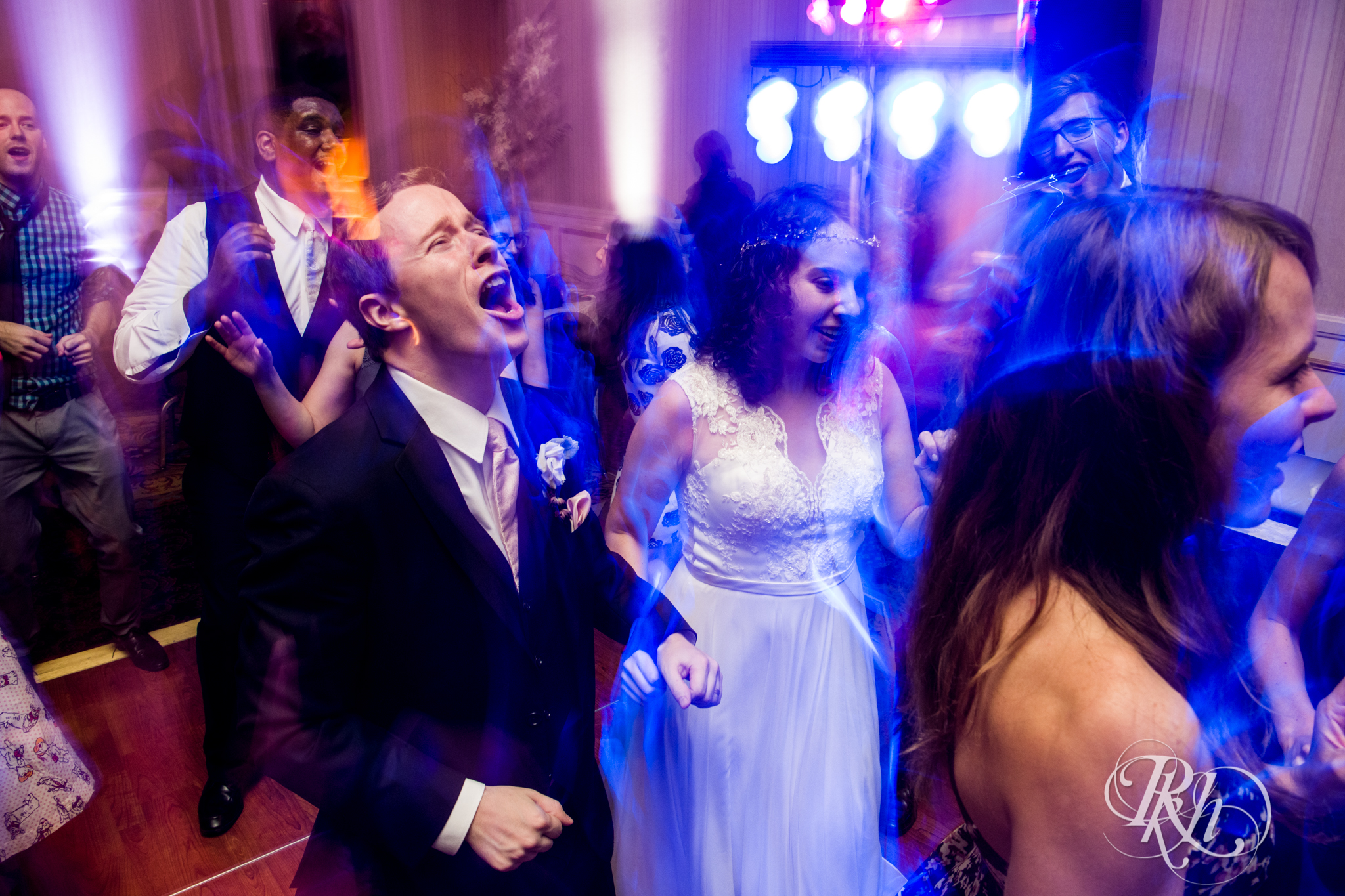 Guests dance during wedding reception at the Saint Paul Hotel in Saint Paul, Minnesota.
