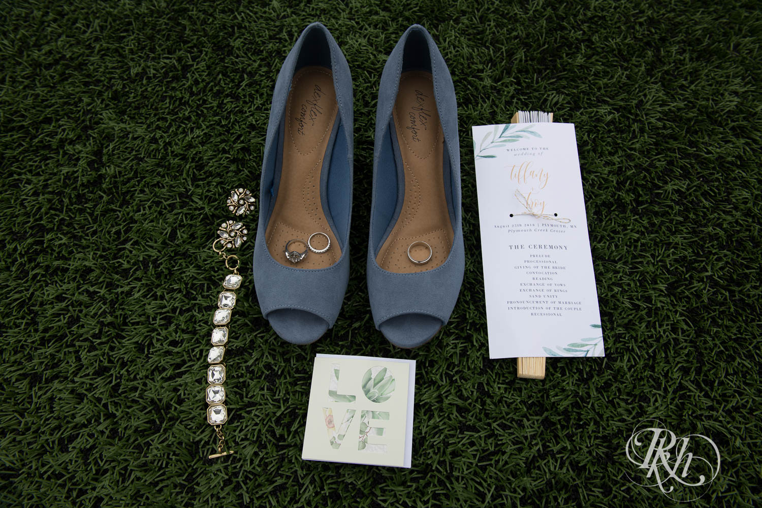 Wedding shoes, rings, and invites at Plymouth Creek Center in Plymouth, Minnesota.