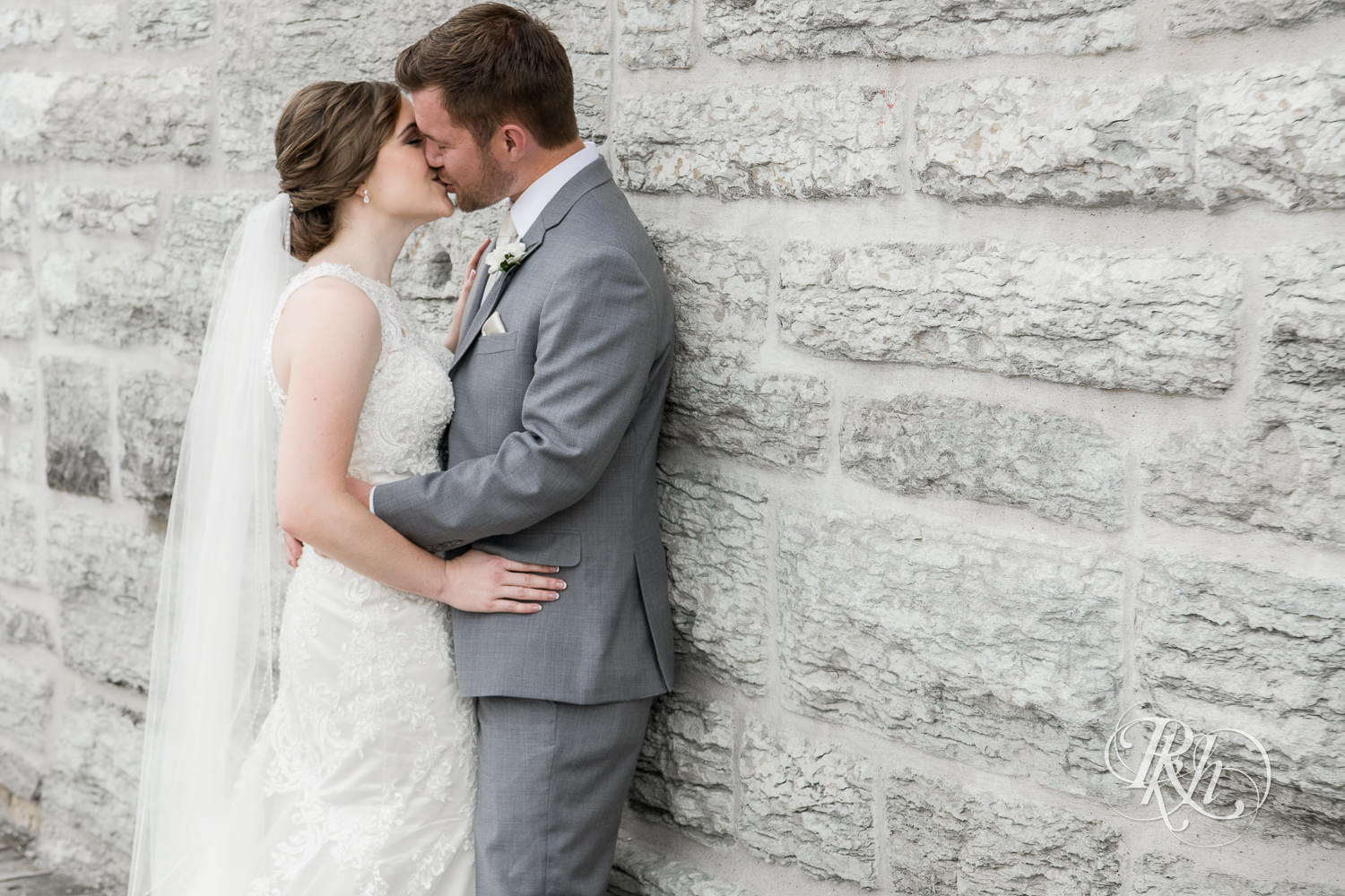 Bride and groom kiss at Mill City Ruins in Minneapolis, Minnesota.