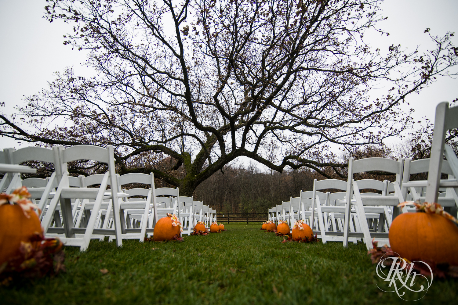 Outdoor Halloween wedding ceremony setup at Mayowood Stone Barn in Rochester, Minnesota.