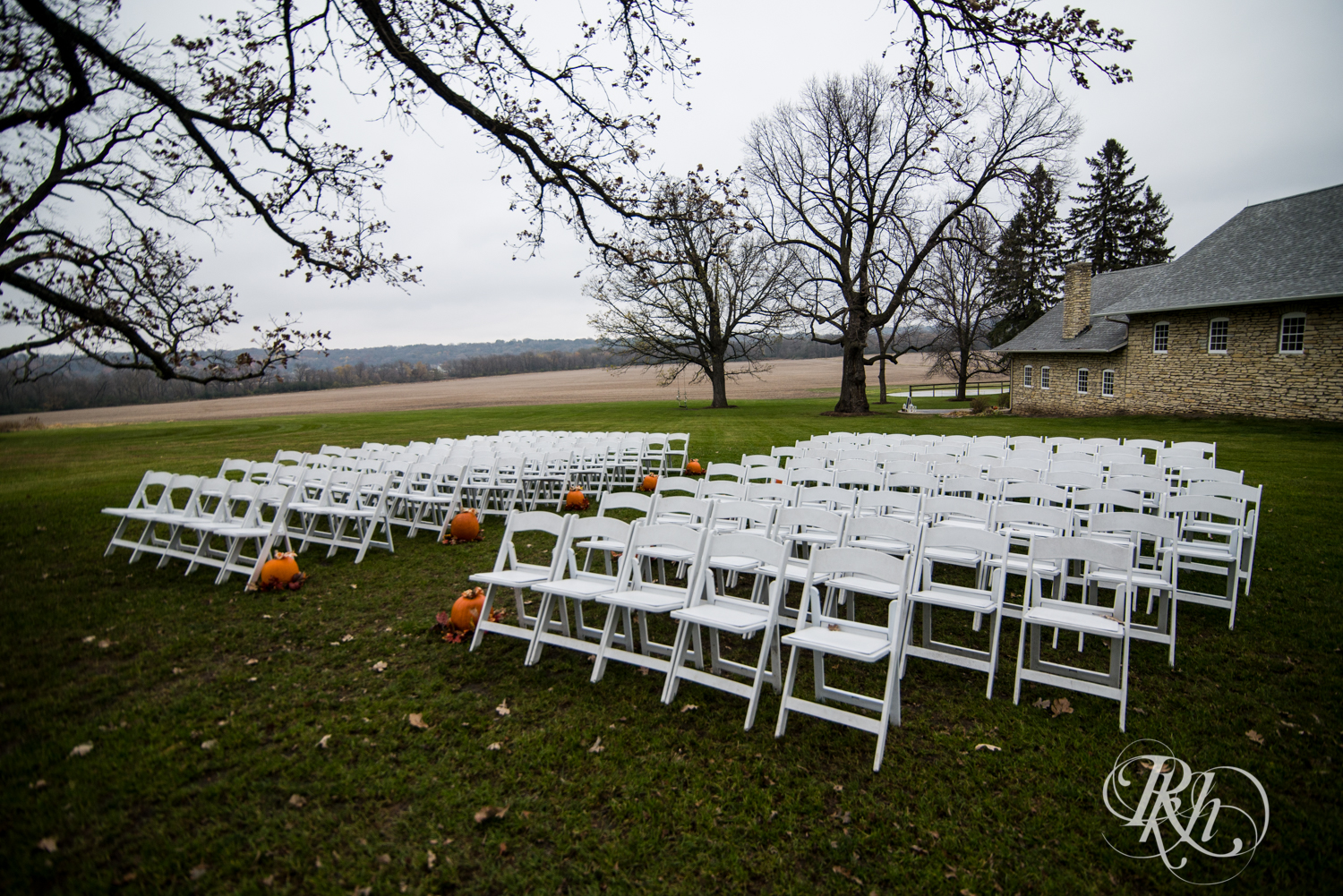 Outdoor Halloween wedding ceremony setup at Mayowood Stone Barn in Rochester, Minnesota.