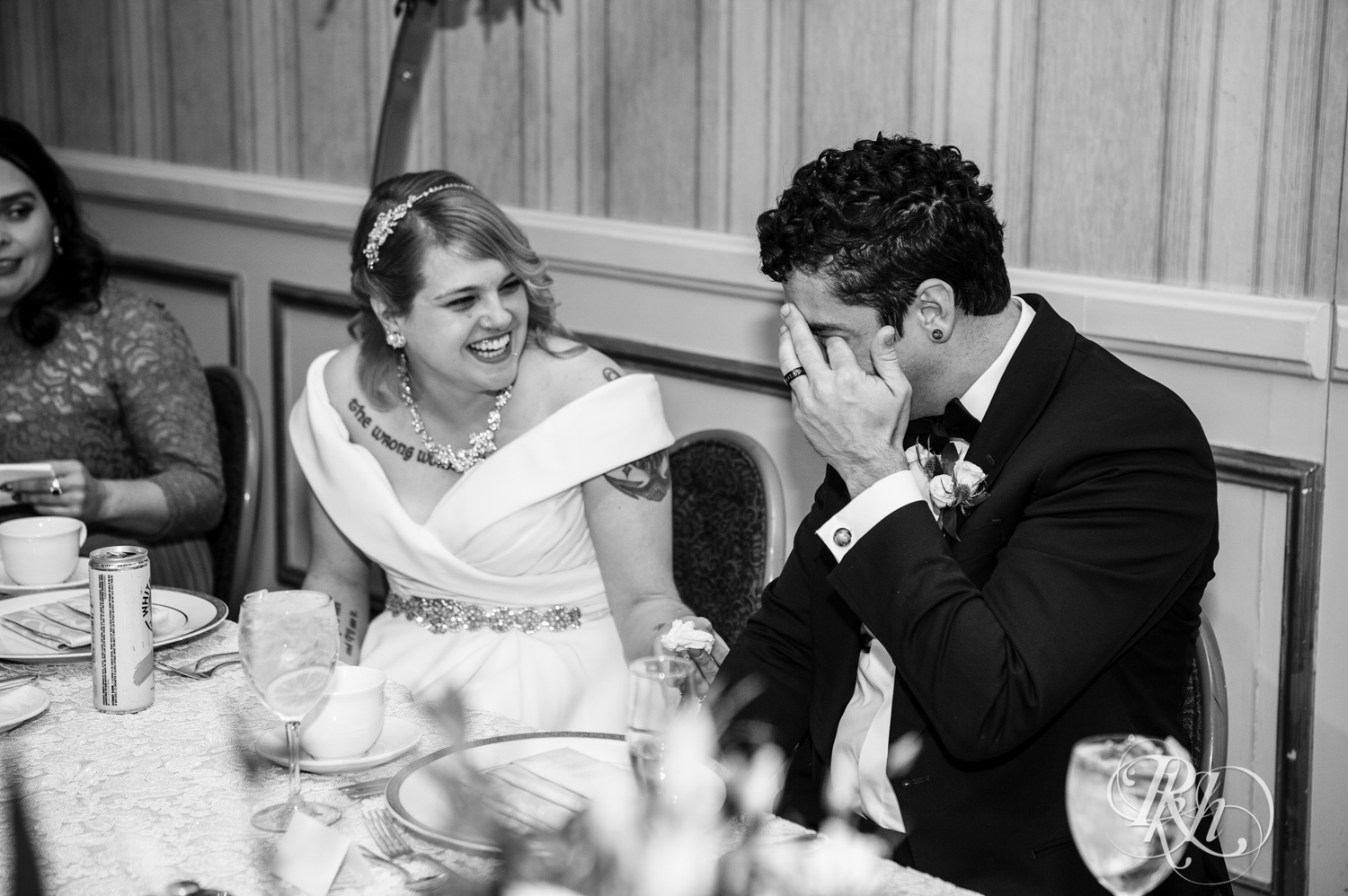 Bride and groom cry during speeches at wedding reception at the Saint Paul Hotel in Saint Paul, Minnesota.