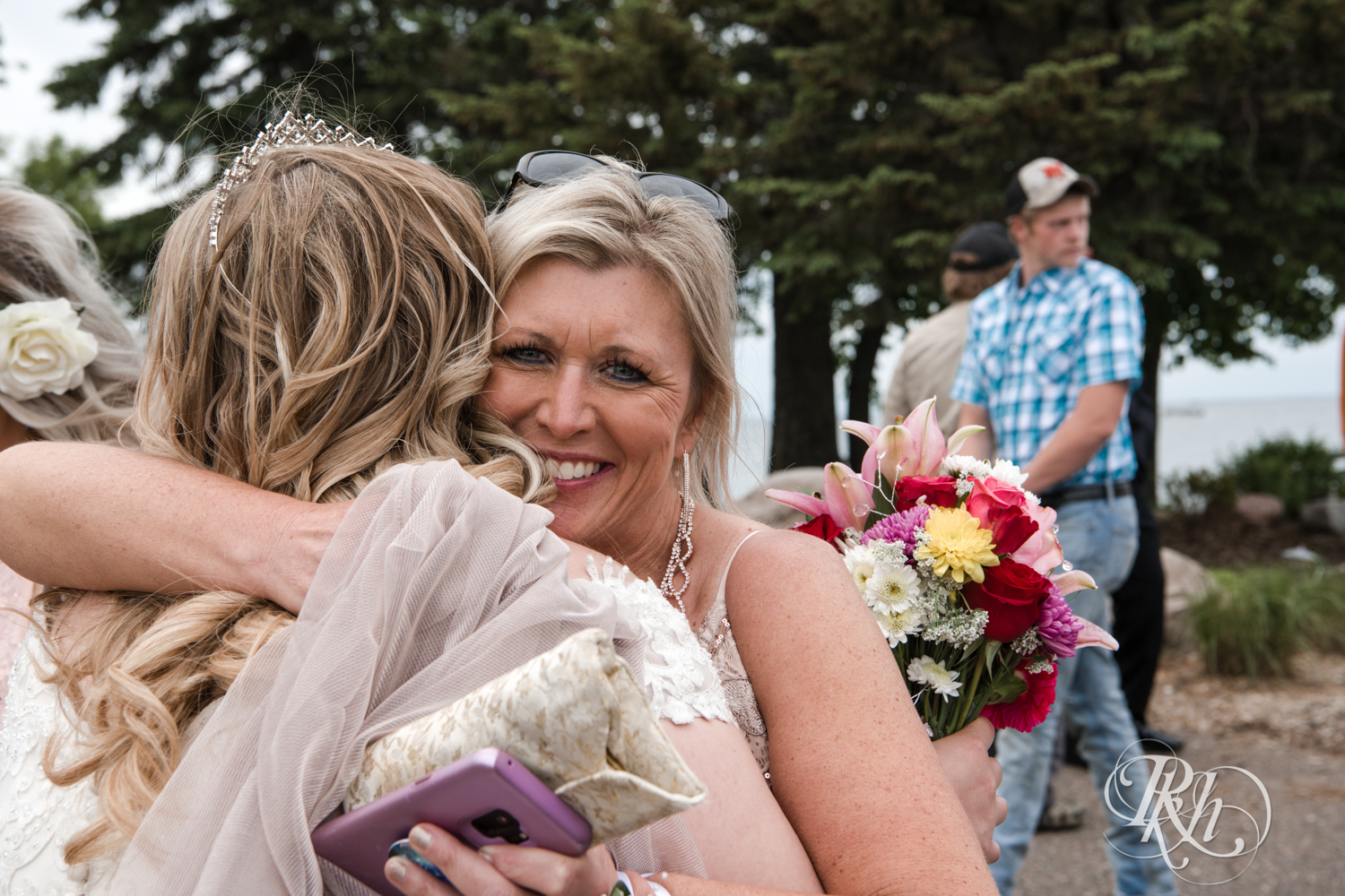 Mom hugging bride