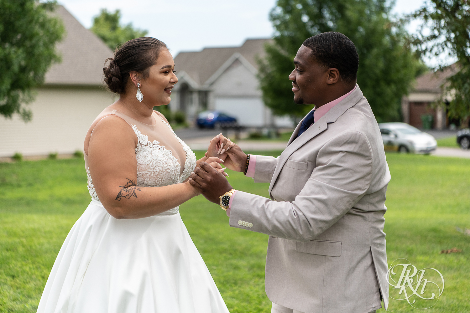 Black bride and groom share first look at home wedding in Brooklyn Park, Minnesota.