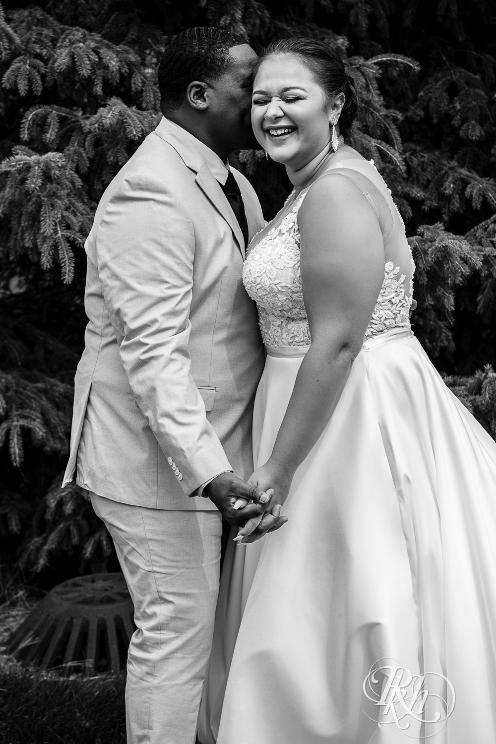 Black bride and groom kiss at home wedding in Brooklyn Park, Minnesota.