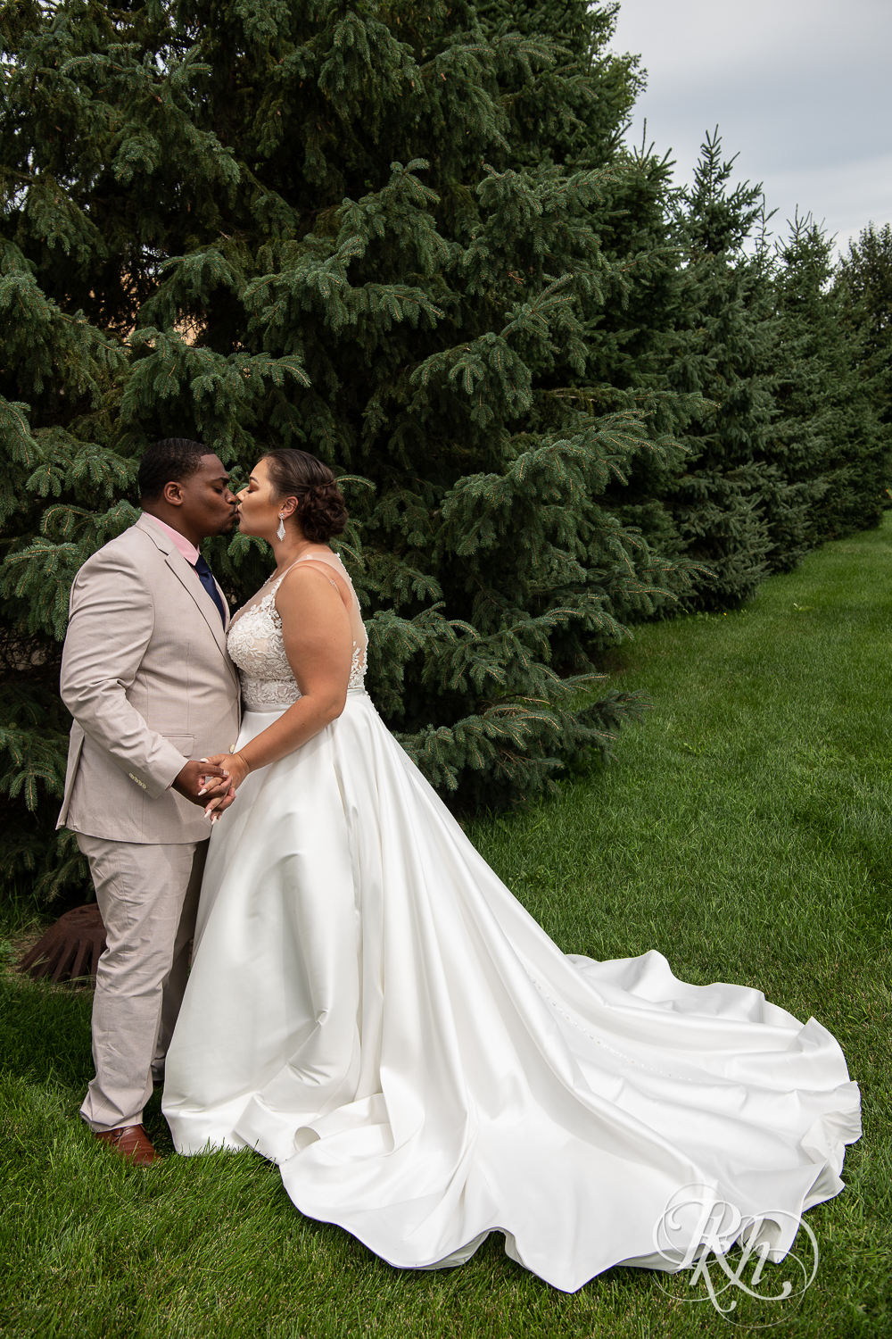 Black bride and groom kiss at home wedding in Brooklyn Park, Minnesota.