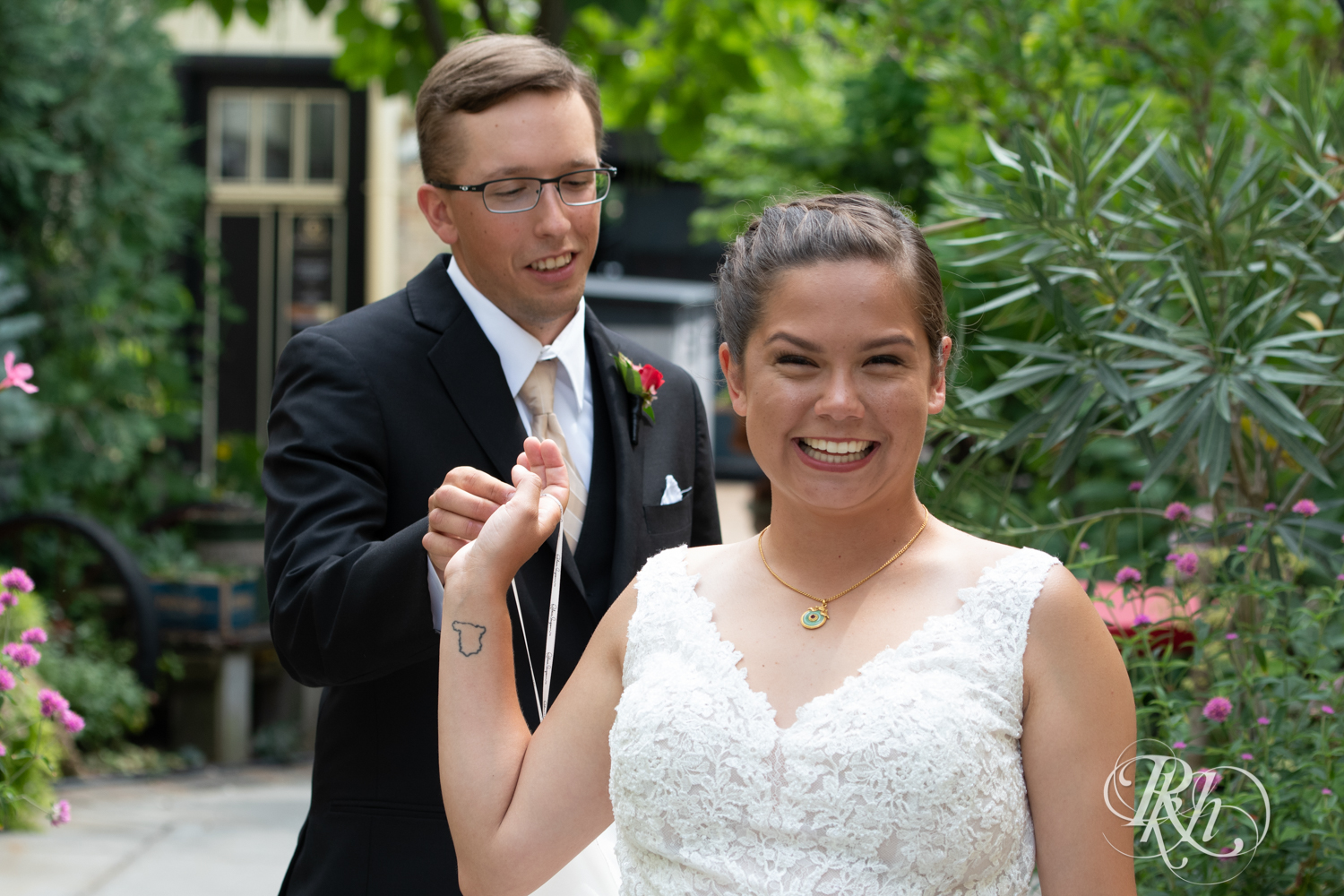 Bride and groom smile at Kellerman's Event Center wedding in White Bear Lake, Minnesota.