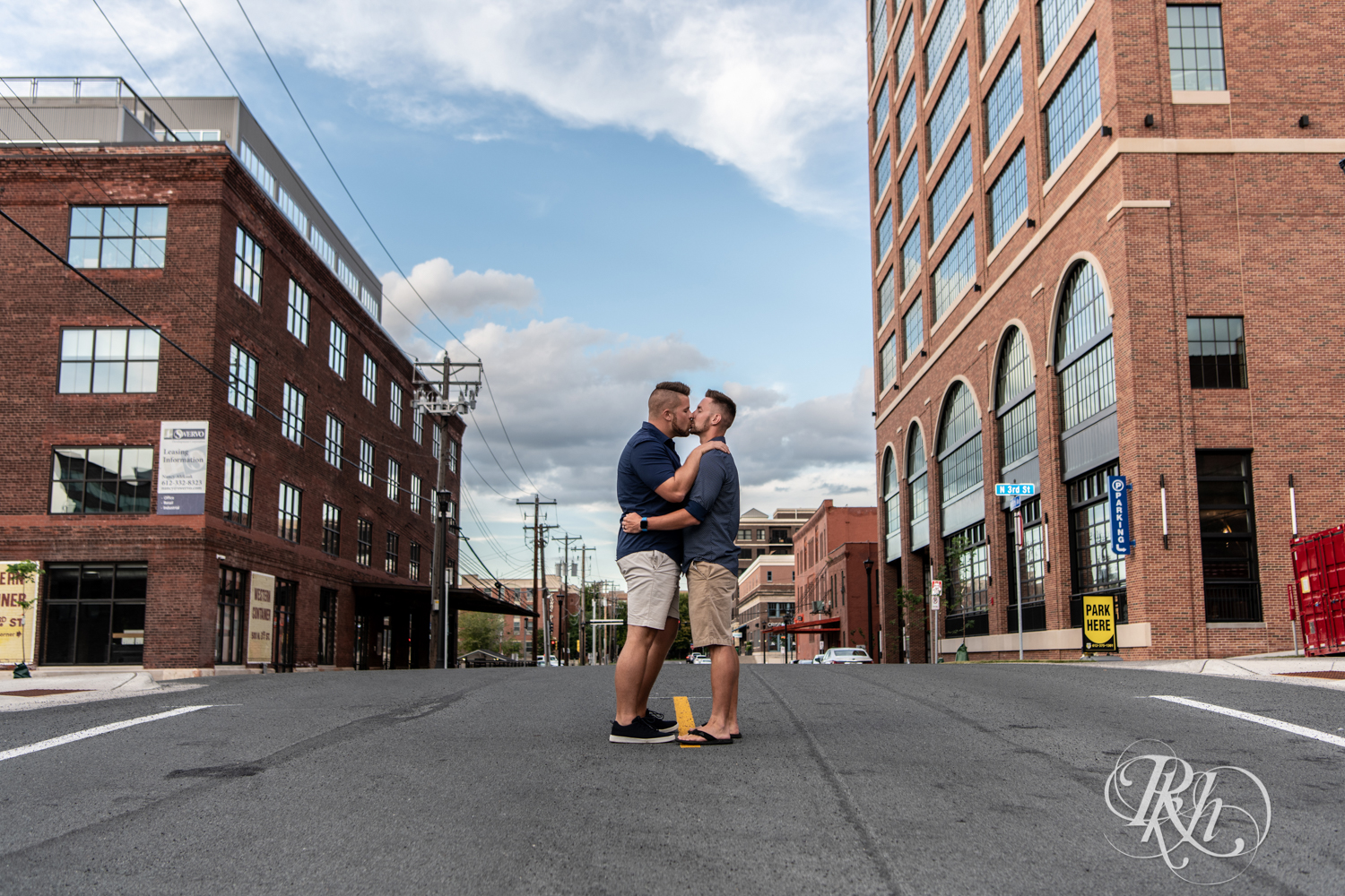 Two men kiss in the middle of the road in Minneapolis, Minnesota.