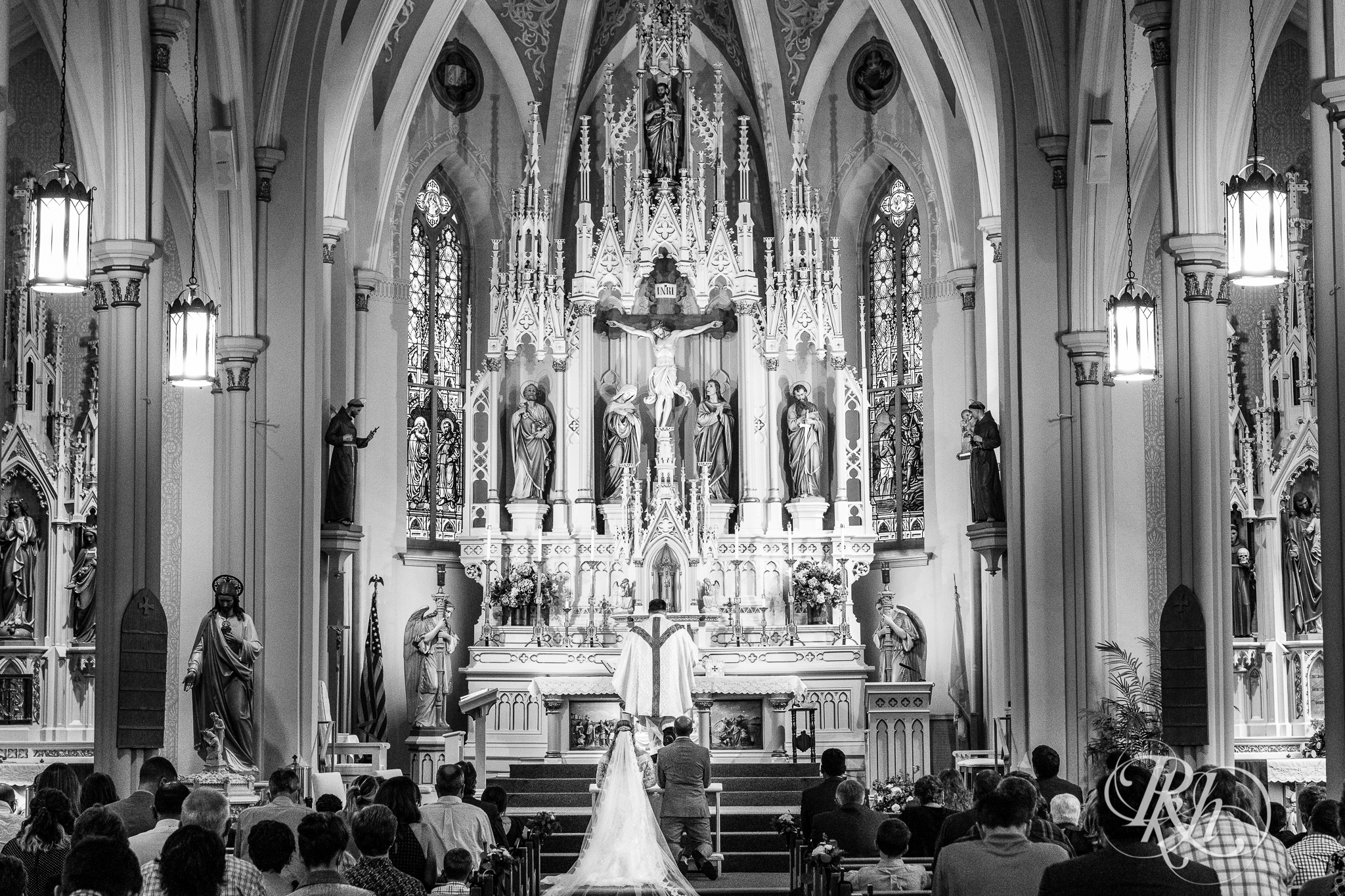Bride and groom taking communion at church wedding in New Prague, Minnesota.