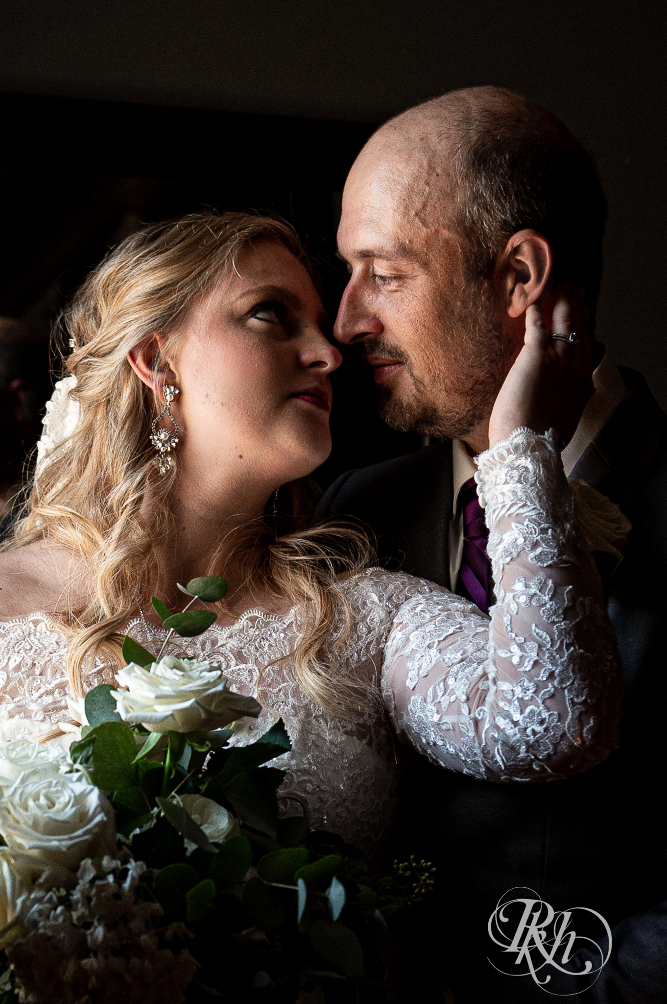Bride and groom kiss at Weddings at the Broz in New Prague, Minnesota.