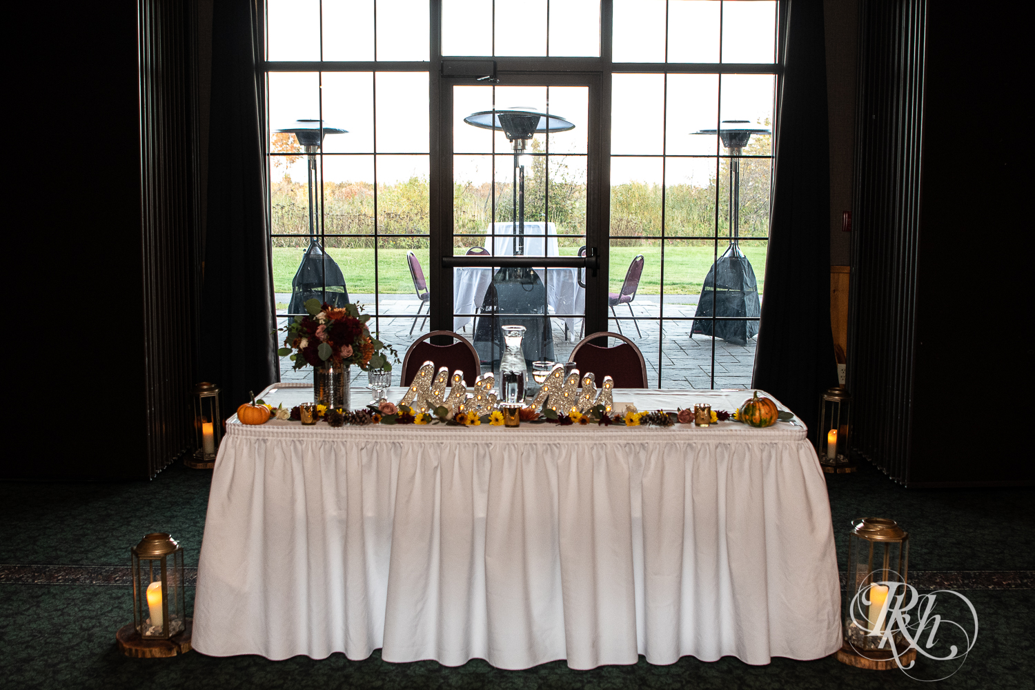 Indoor wedding reception sweetheart table at Superior Shores Resort in Two Harbors, Minnesota.