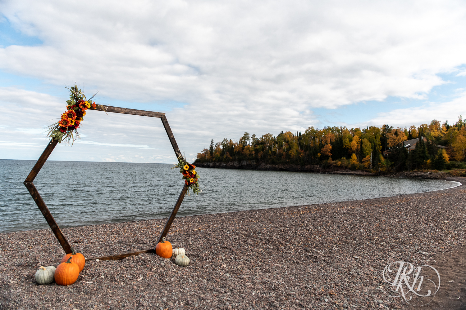 Outdoor wedding ceremony in front of Lake Superior at Superior Shores Resort in Two Harbors, Minnesota.